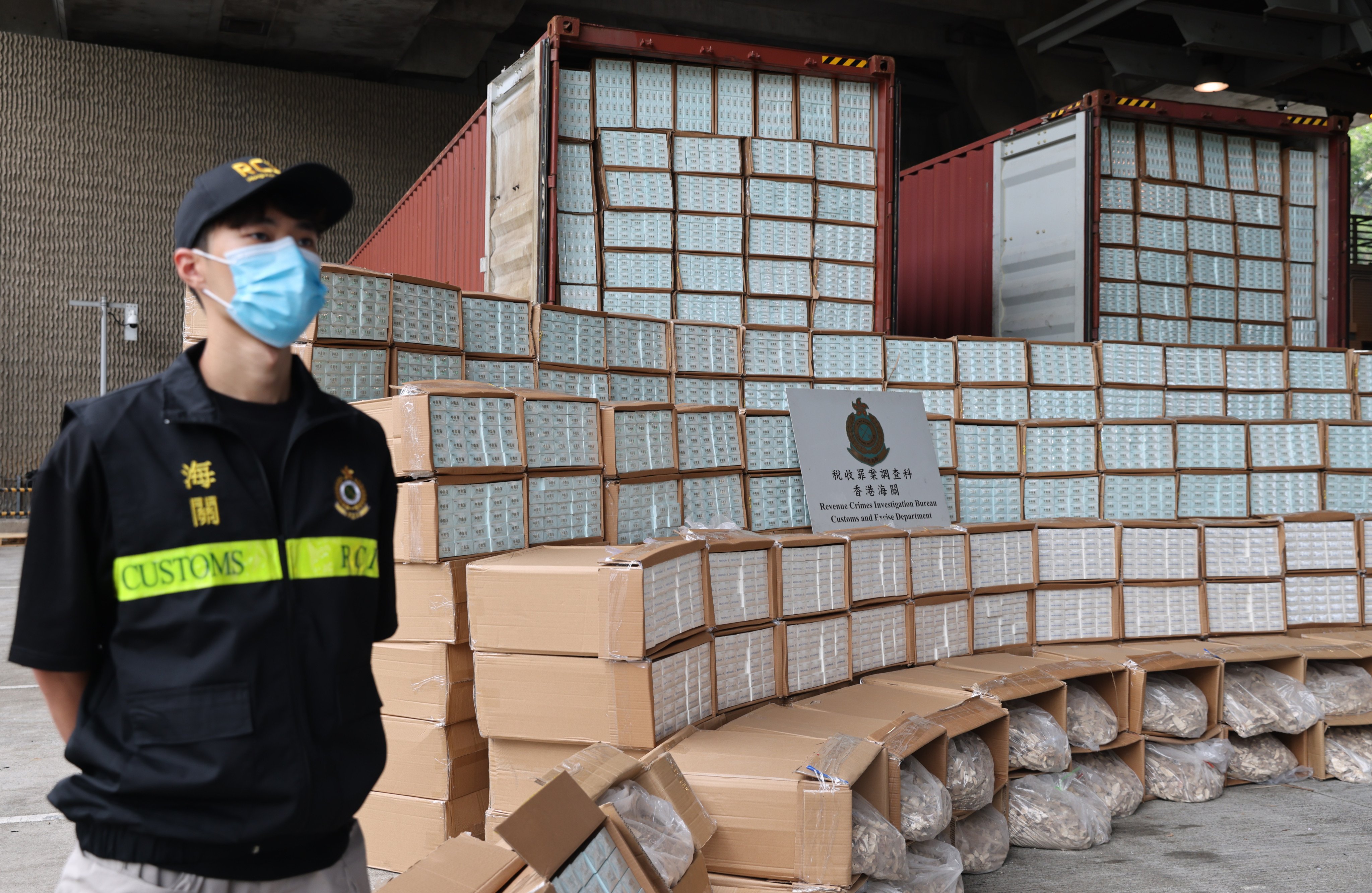Customs officials display a HK$62 million haul of black market cigarettes discovered on a cargo ship from Cambodia. Photo: Yik Yeung-man