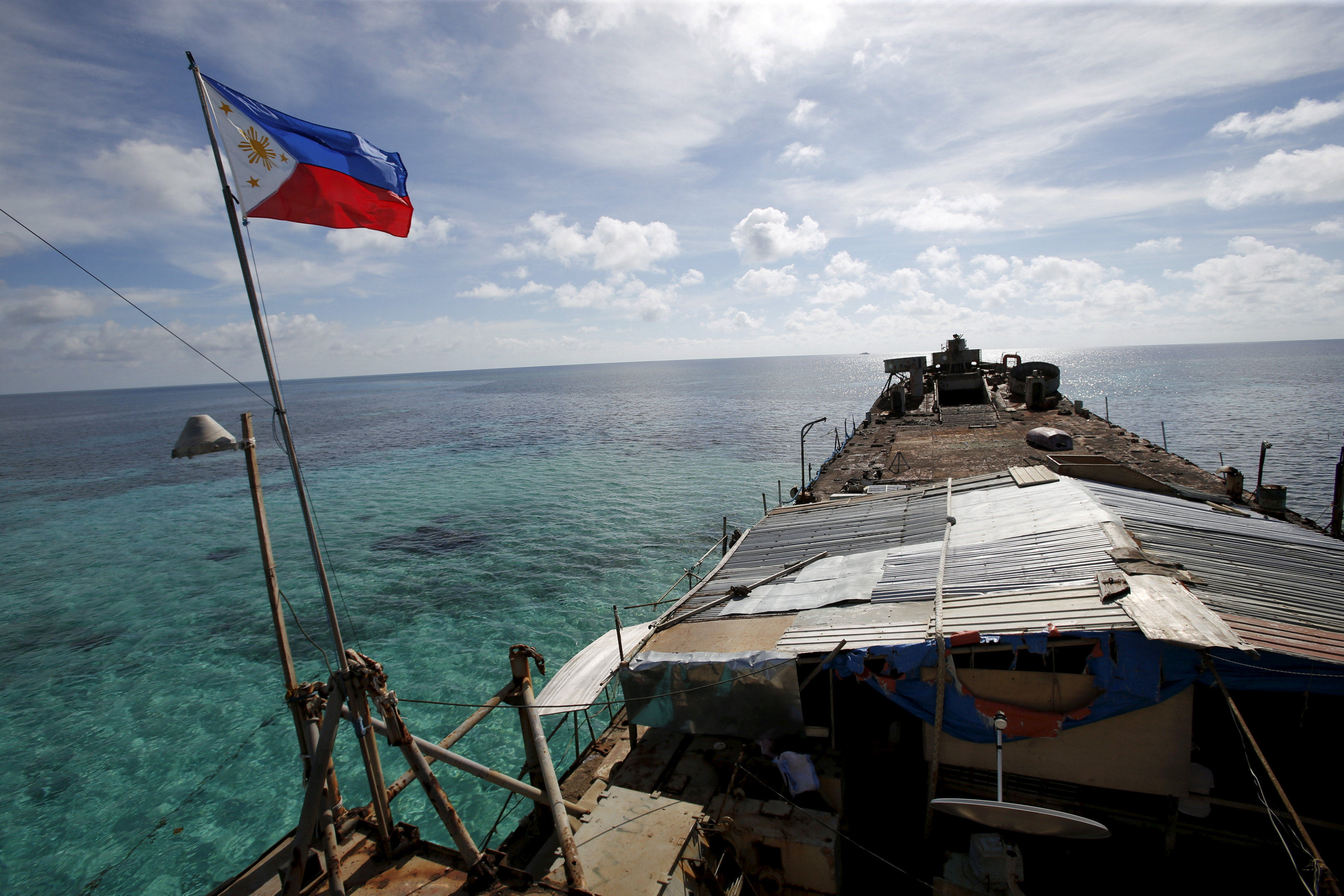 A Philippine flag flutters from BRP Sierra Madre, a dilapidated Philippine Navy ship that has been aground since 1999 on the disputed Second Thomas Shoal in the South China Sea. File photo: Reuters
