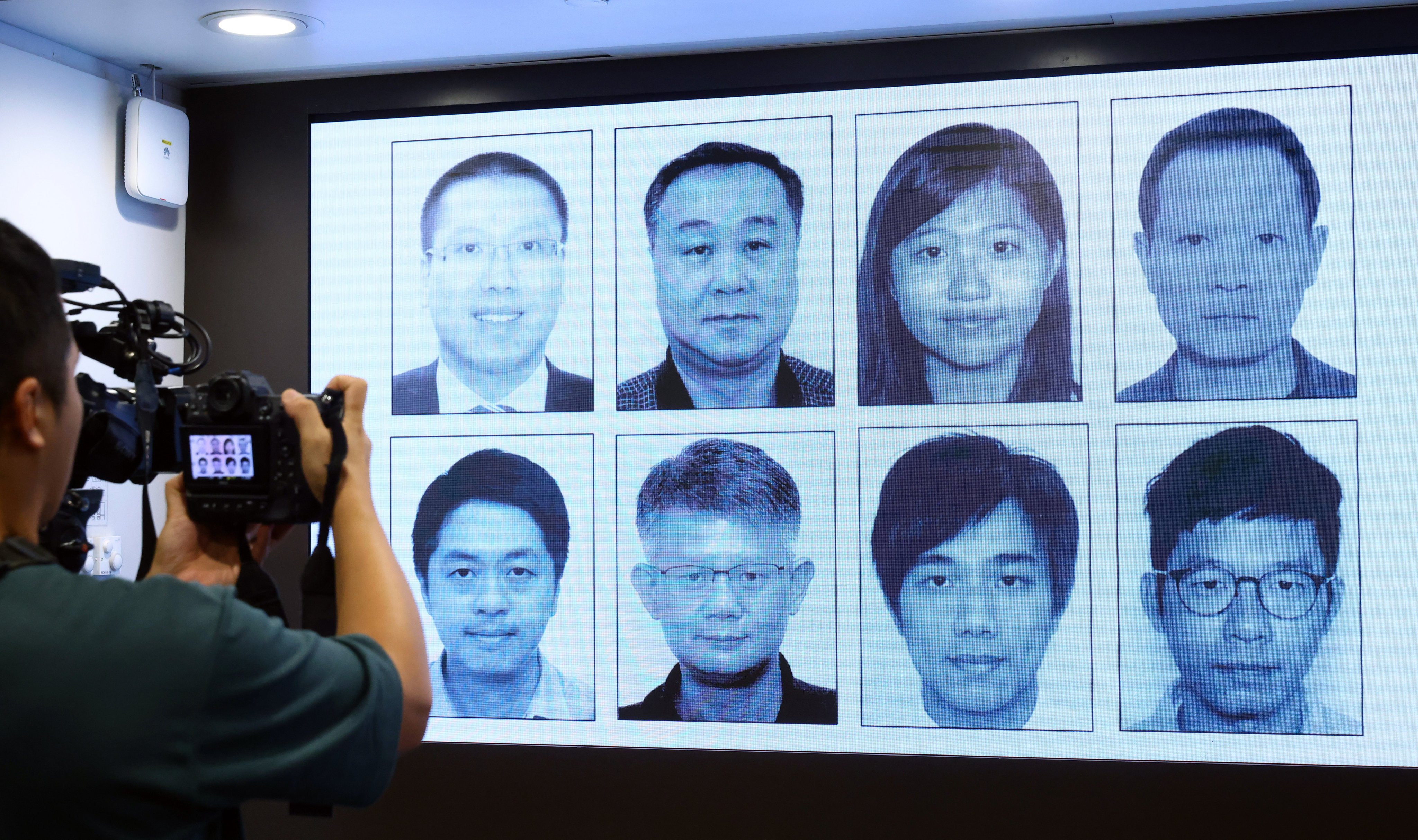 A line-up of the eight wanted activists shown as the National Security Department offered a HK$1 million reward on each of their heads, with Nathan Law at bottom right. Photo: Dickson Lee