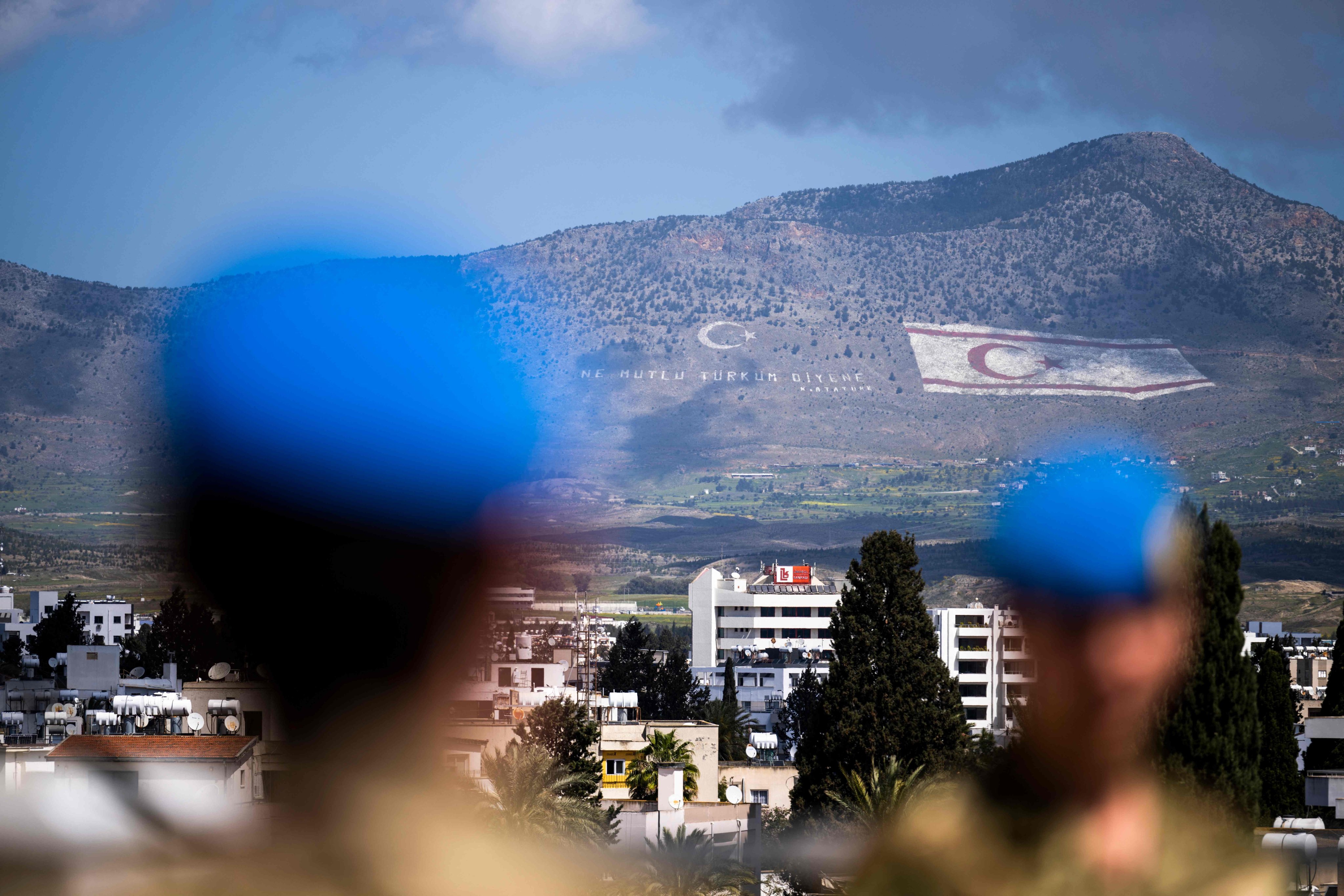Members of the UN Peacekeeping Force in Cyprus on the roof of the Ledra Palace in the buffer zone separating the divided capital of Nicosia. Photo: AFP