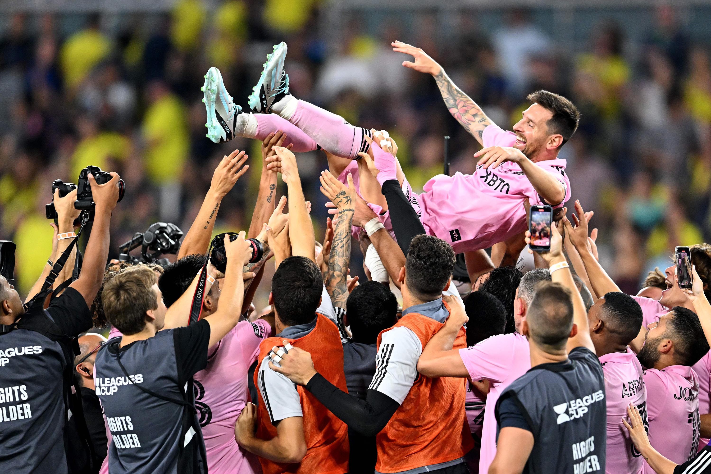 Inter Miami teammates hold Lionel Messi aloft as they celebrate after winning the Leagues Cup final against Nashville. Photo: TNS