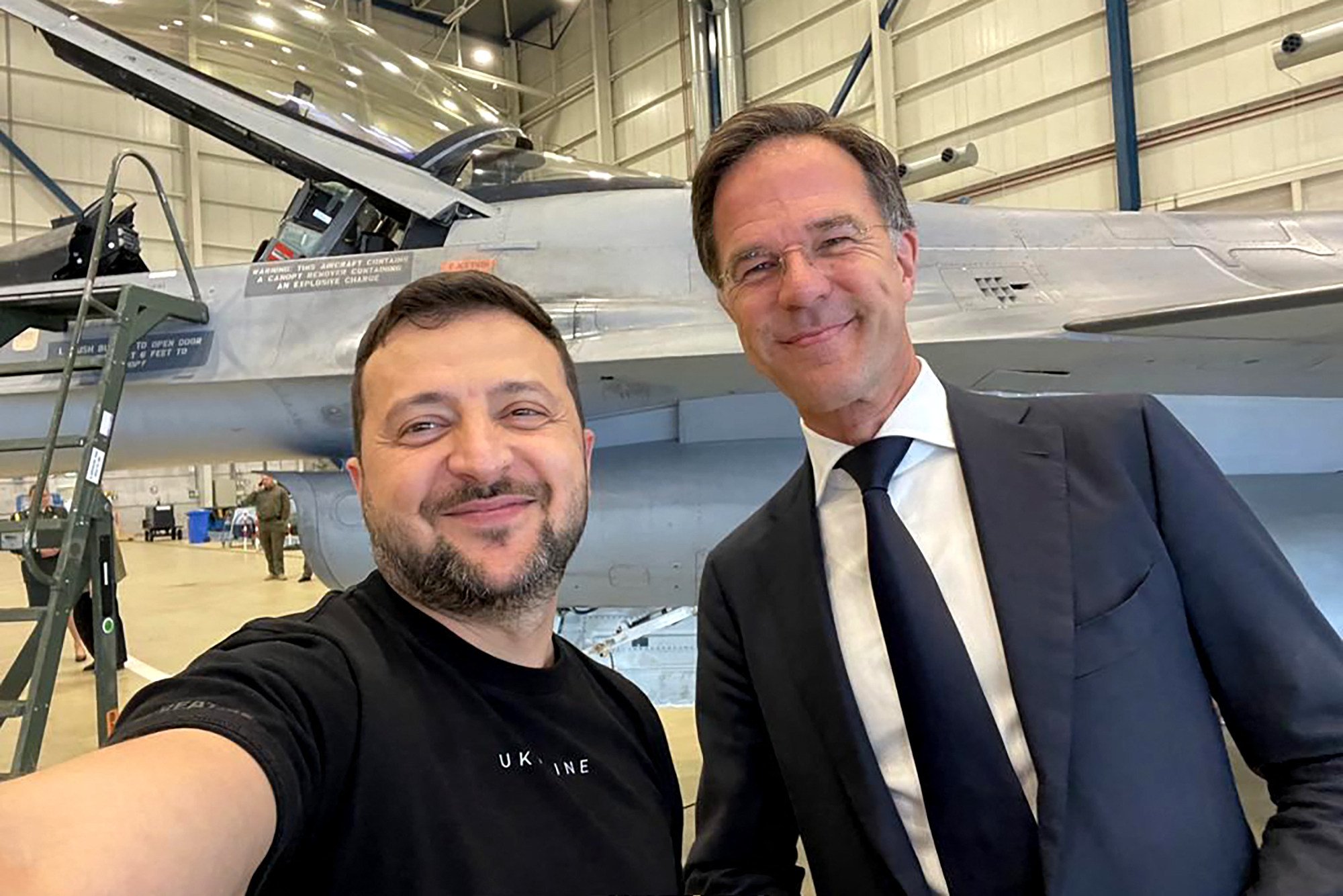 Ukraine’s President Volodymyr Zelensky (left) takes a selfie with Dutch Prime Minister Mark Rutte during a visit to the Eindhoven Military Air Base in Eindhoven on Sunday. Photo: Ukrainian Presidential Press Service/AFP