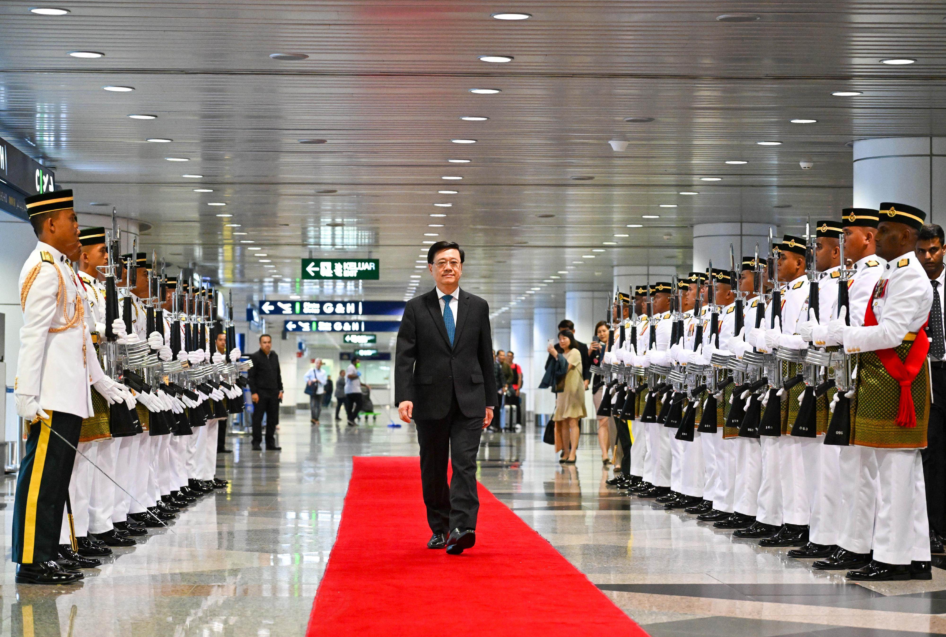 Chief Executive John Lee Ka-chiu receives a red carpet reception upon his arrival in Kuala Lumpur on July 27. Lee and his administration have made attracting global talent and promoting Hong Kong abroad high priorities, but many pressing concerns about life in the city remain unaddressed. Photo: Information Services Department handout