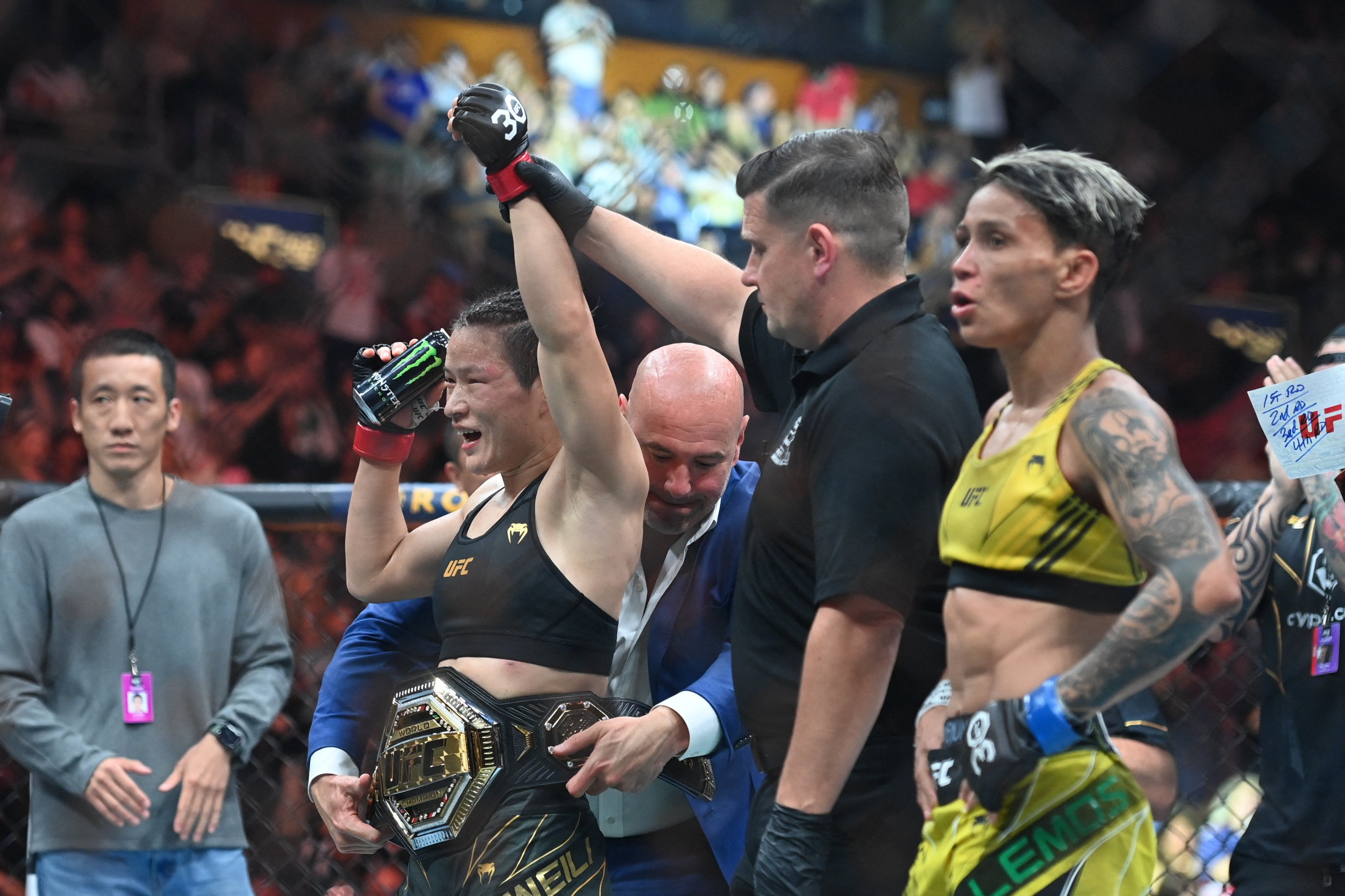 Dana White wraps the UFC strawweight title around Zhang Weili’s waist at UFC 292 in Boston. Photo: USA TODAY Sports