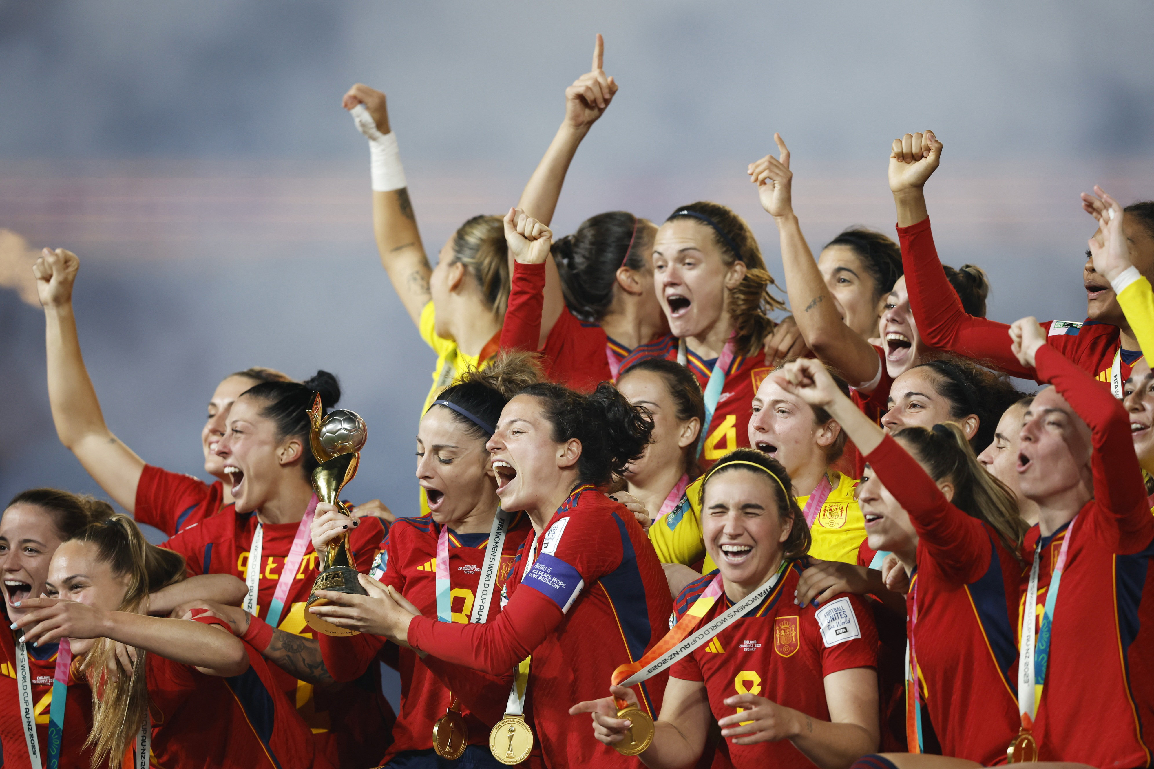 Spain players celebrate with the trophy after winning the World Cup. Photo: Reuters