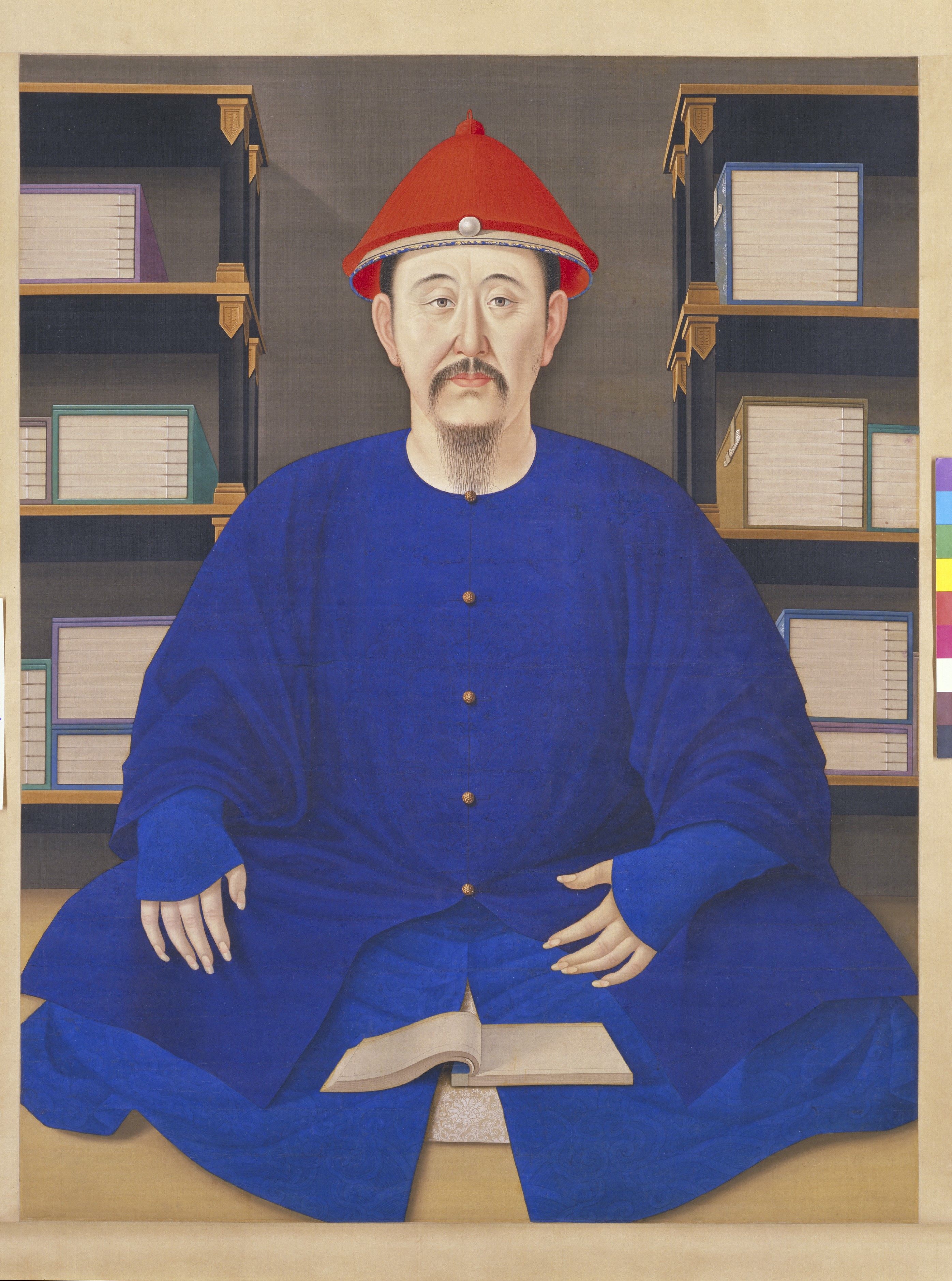 “Kangxi Portrait” (1622). This hanging scroll that will be part of the upcoming CMA exhibition shows the Qing dynasty Emperor Kangxi sitting in front of his books. Photo: The Palace Museum, Beijing