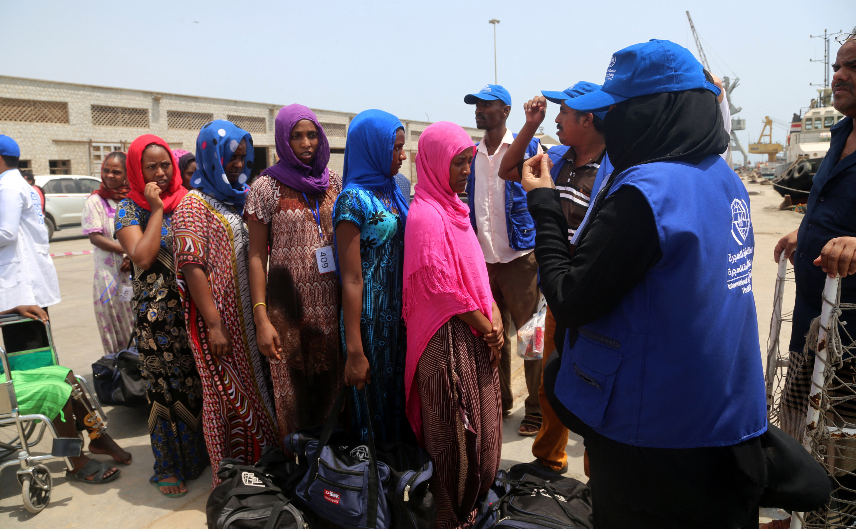 Employees of the International Organisation for Migration (IOM) assist Ethiopian migrants to board a ship repatriating them home in Yemen’s rebel-held Red Sea port of Hodeida in 2018. File photo: AFP