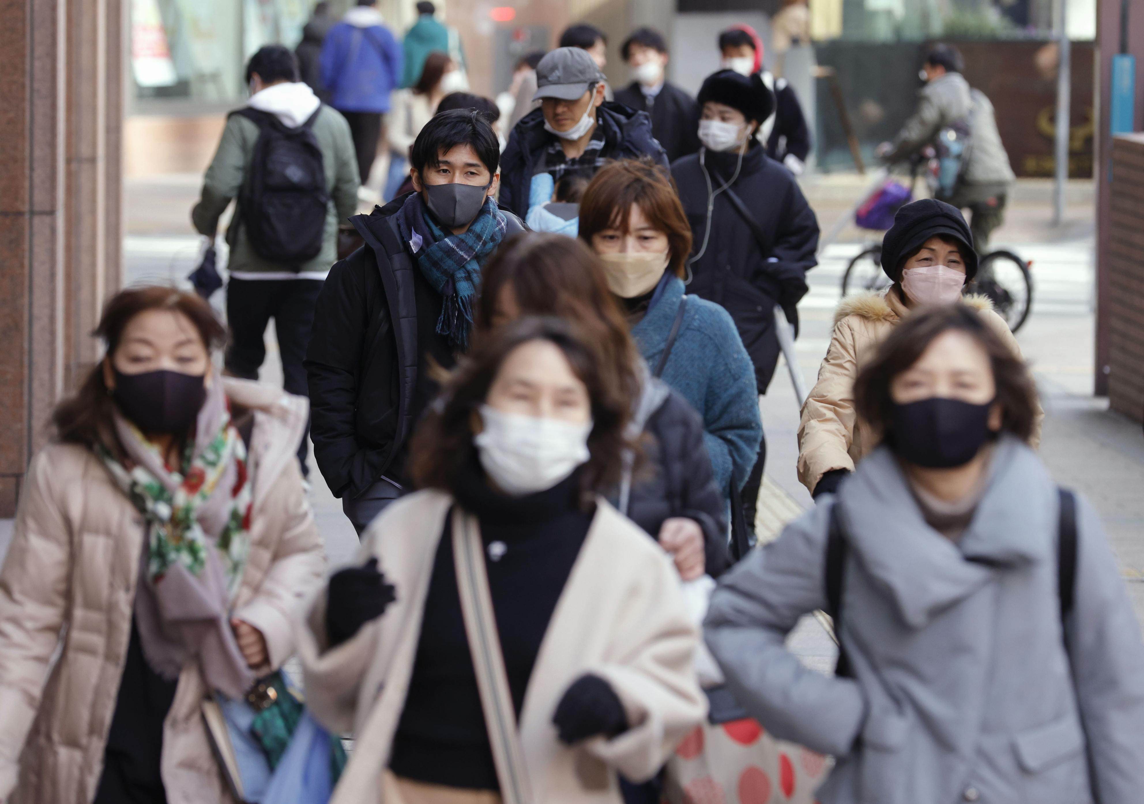 Peoplein the Tenjin business and commercial area in Fukuoka, southwestern Japan. Photo: Kyodo