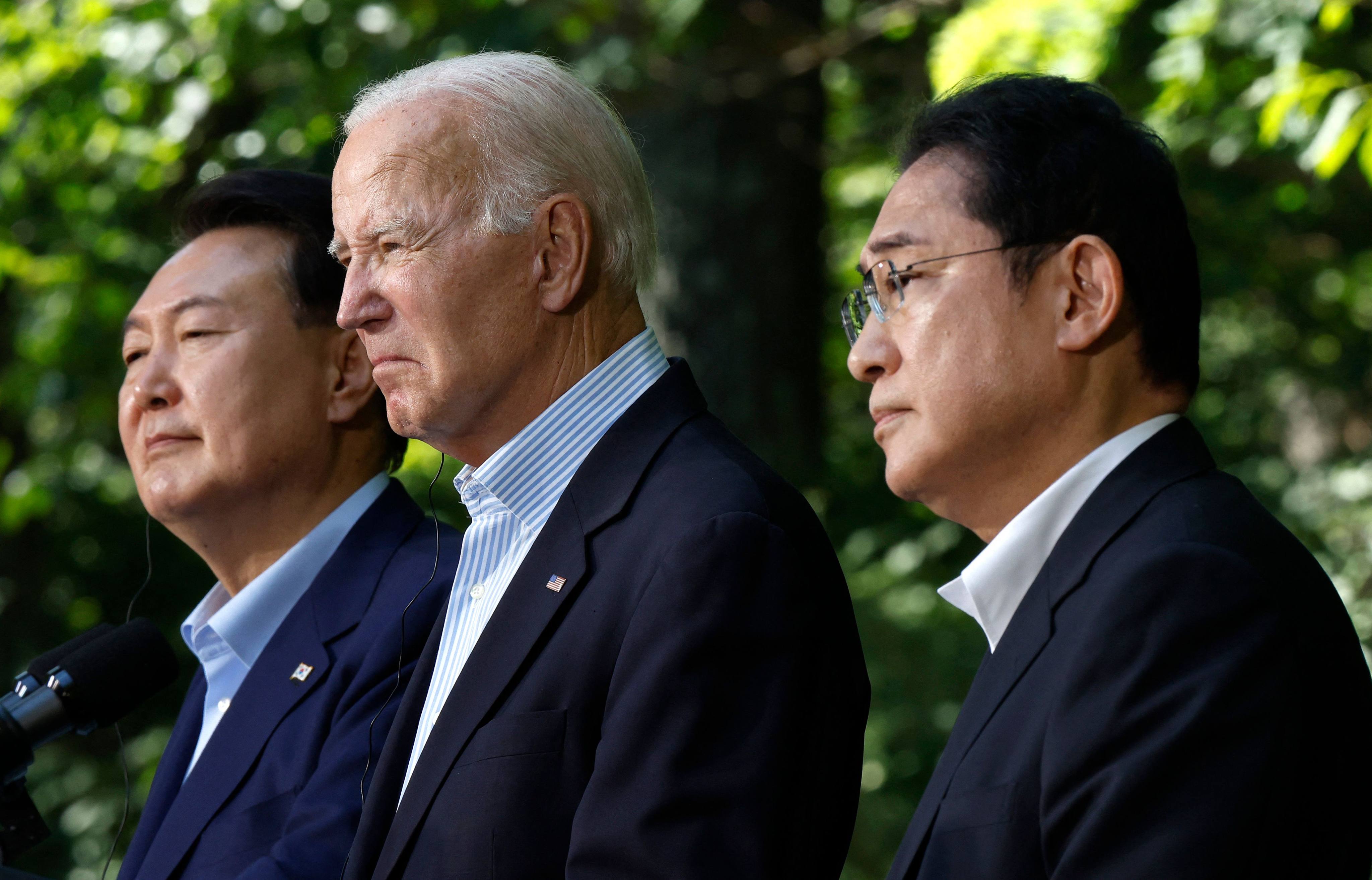 South Korean President Yoon Suk Yeol, US President Joe Biden and Japanese Prime Minister Fumio Kishida hold a joint news conference following three-way talks at Camp David on August 18, 2023. The leaders discussed moving forward in “lockstep” on issues related to military cooperation, international politics, countering China and North Korea and other topics.  Photo: AFP