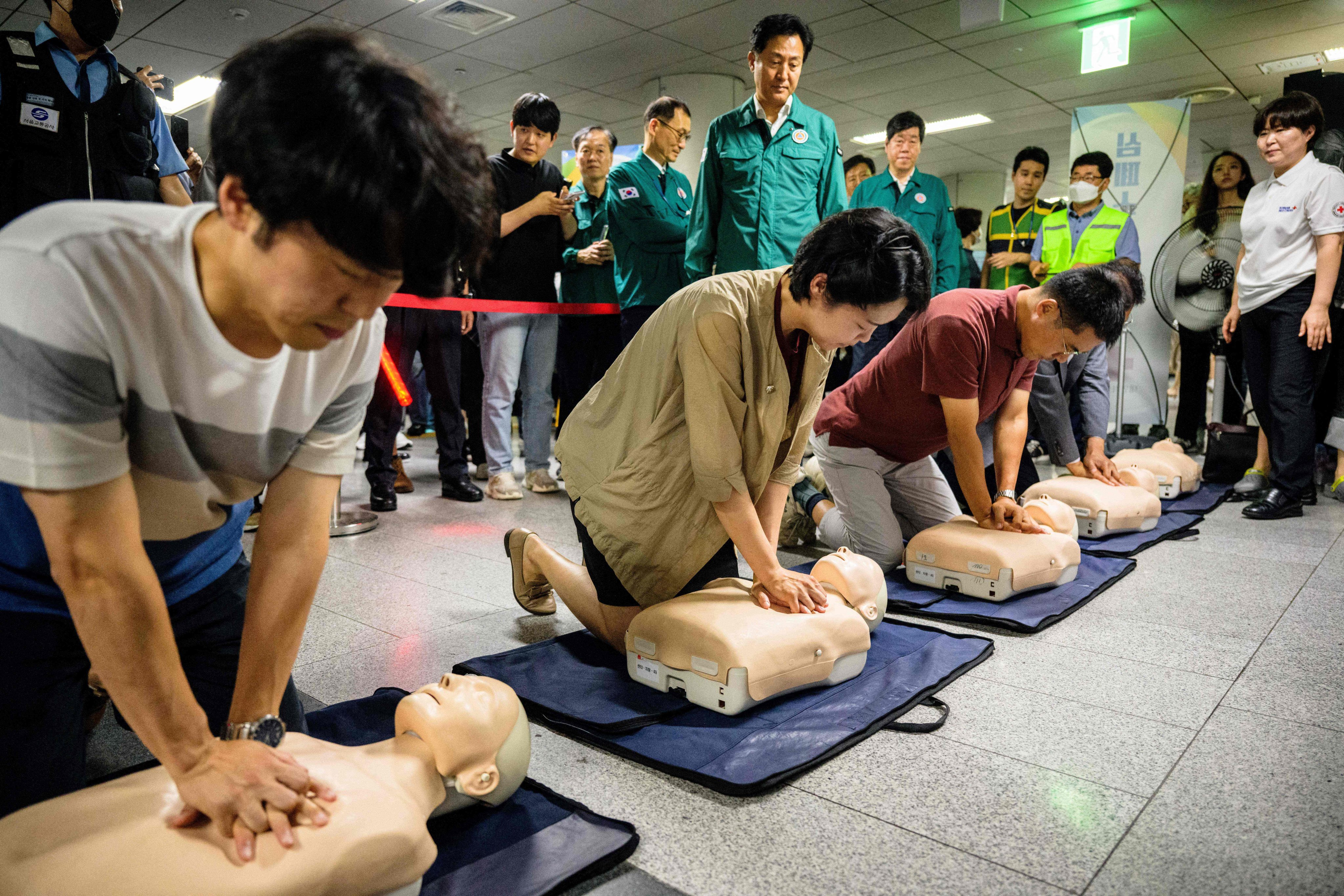 People receive CPR training, practicing on dummies, during a civil defence drill against possible attacks by North Korea, in an underground train station in Seoul on Wednesday. Photo: AFP