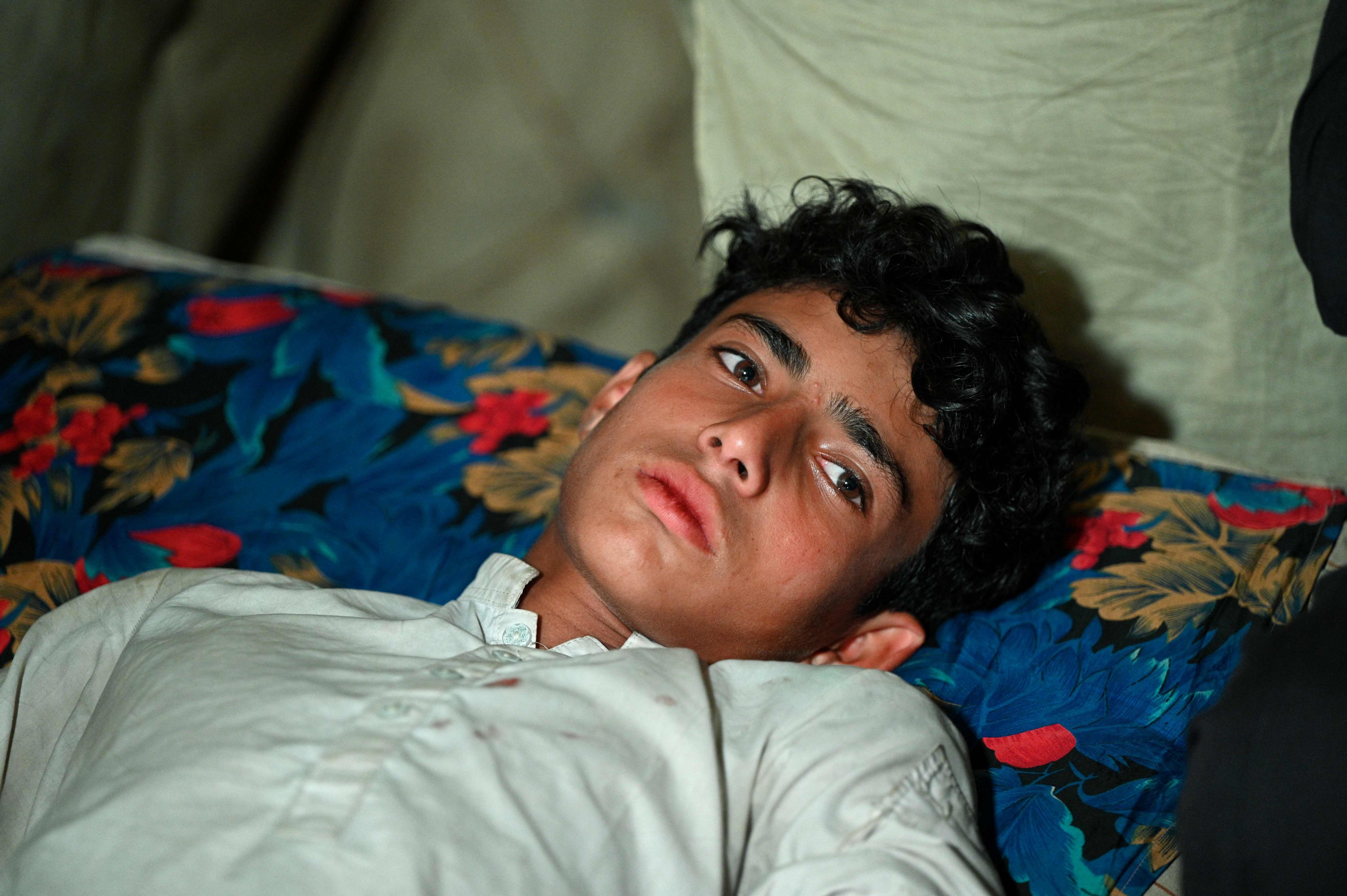 Ibrar Ahmad, a survivor of Pakistan’s cable car accident, receives aid at a health care centre. Photo: AFP