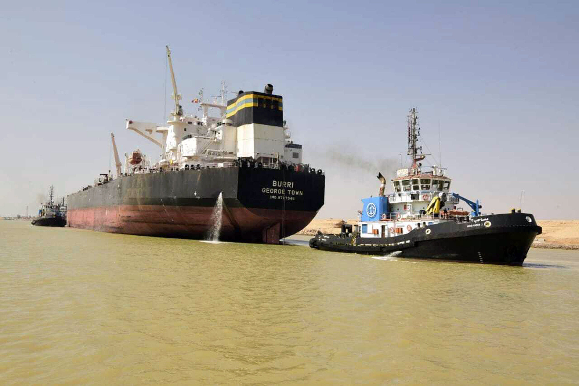 The Burri being towed away in the Suez Canal after a collision with Singapore-flagged tanker BW Lesmes. Photo: Suez Canal Authority via AP