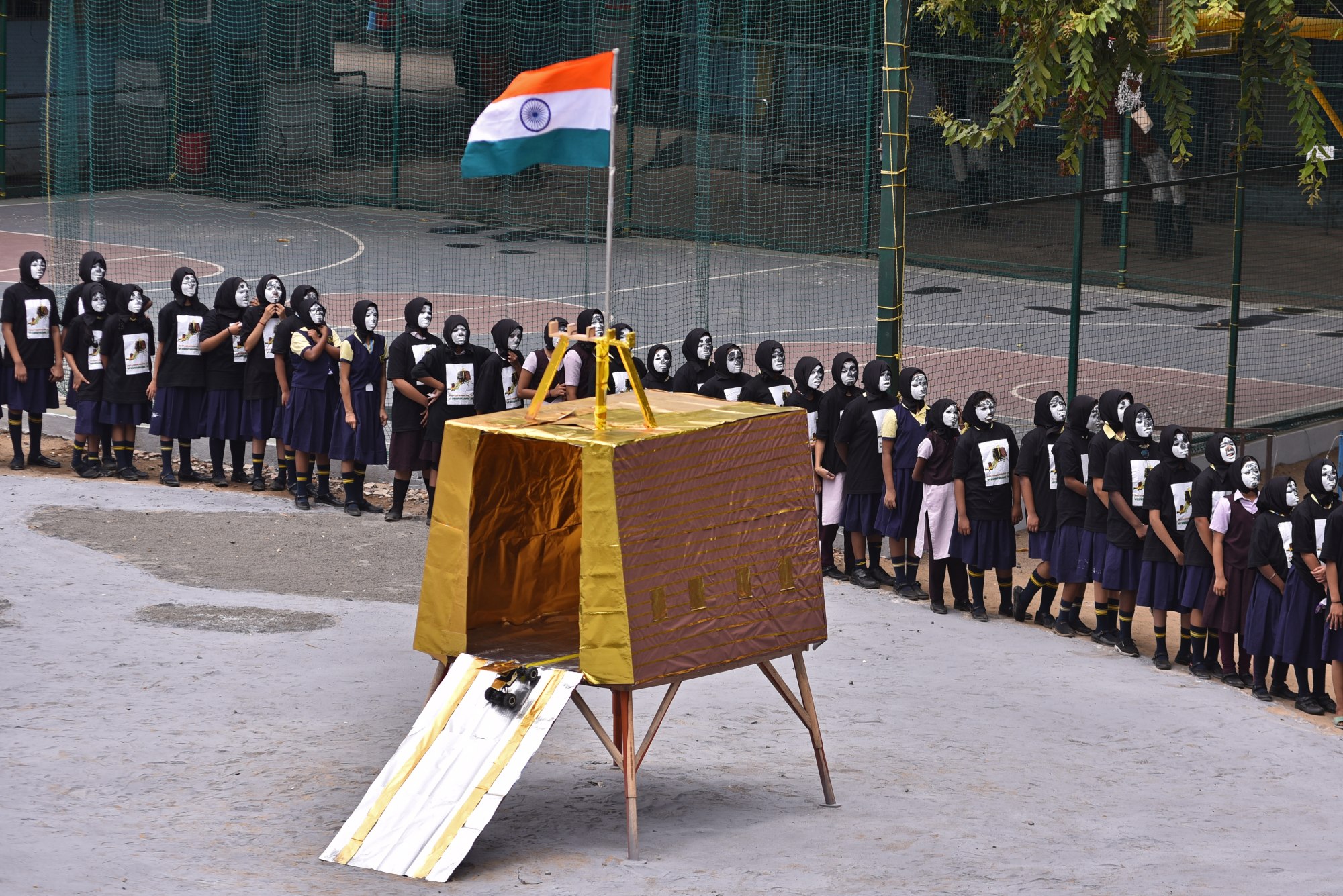 Indian students in Chennai form a circle around a model of the Indian Space Research Organisation’s mission of Chandrayaan-3’s first attempt to land on the moon. Photo: EPA-EFE