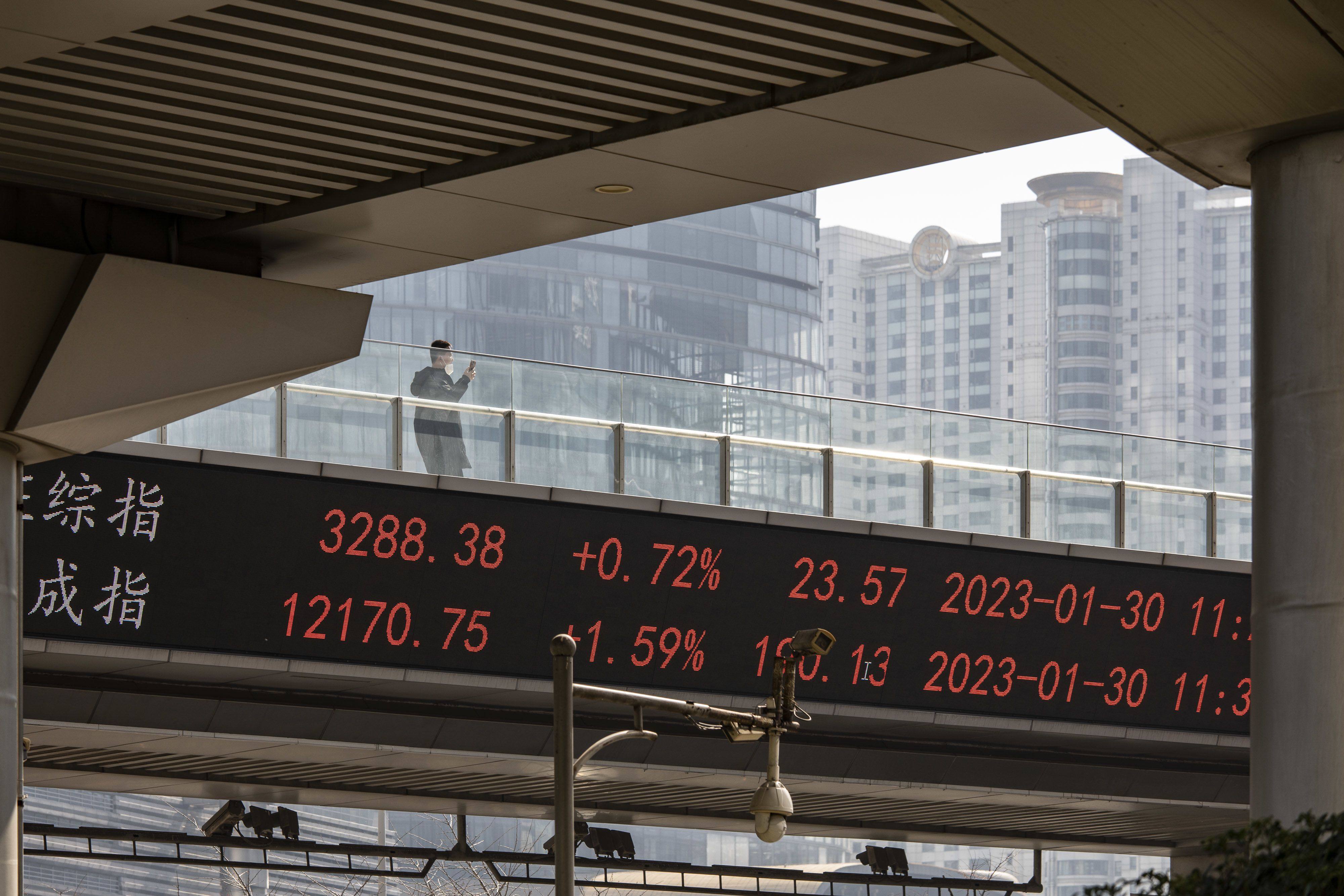 The Shanghai Composite Index and the Shenzhen Component Index displayed on a stock ticker in Pudong’s Lujiazui Financial District in Shanghai, China. Photo: Bloomberg
