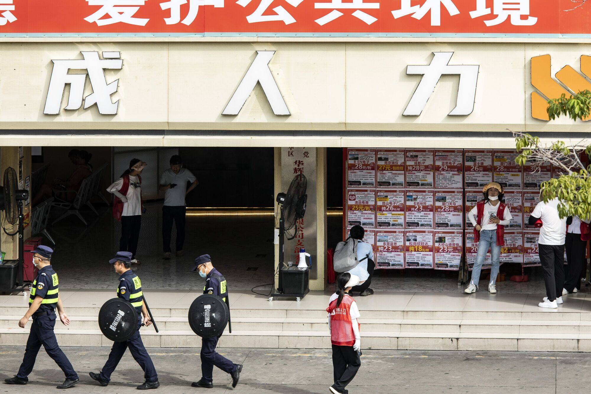 Job adverts are seen at the Lonhua Bus Station, which also serves as a recruitment centre for nearby factories, in Shenzhen on August 9. In the eyes of many international investors, China is on the cusp of a Japan-style “balance sheet recession”. Photo: Bloomberg