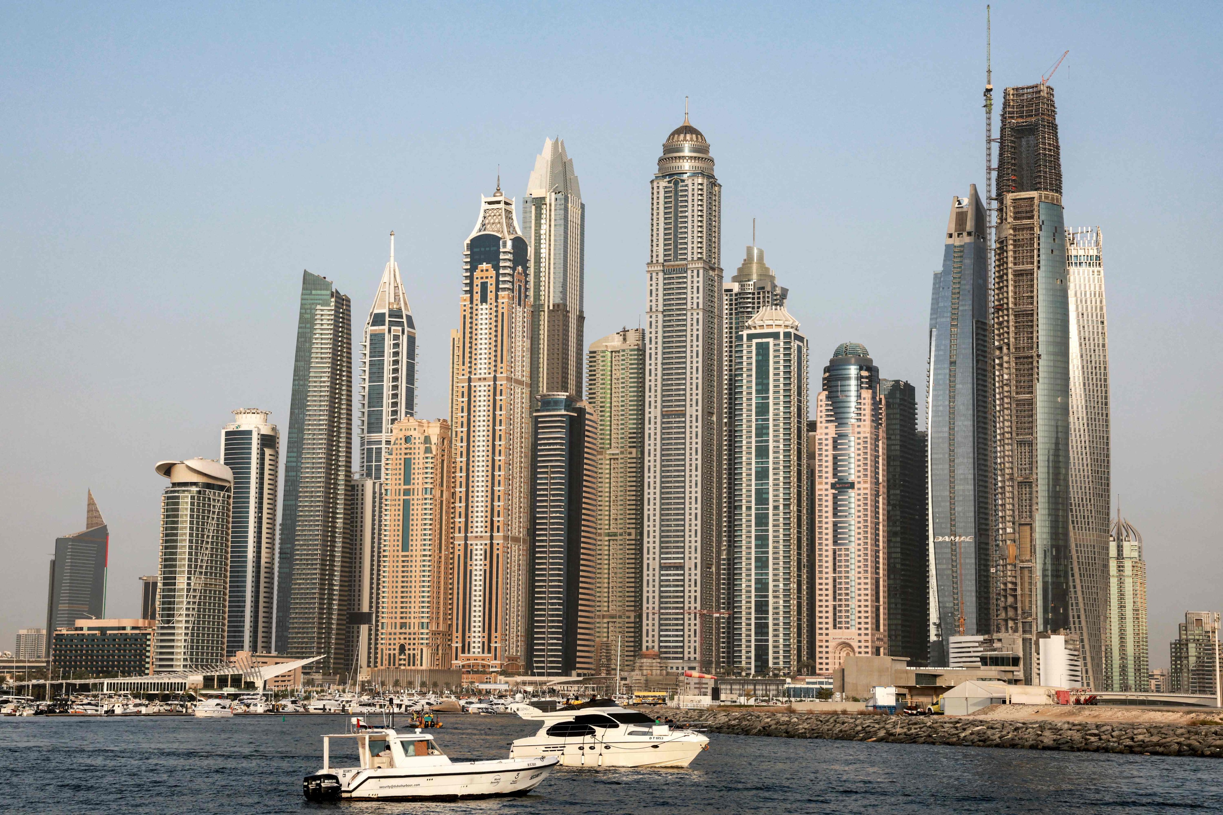 Boats ply the waters of the Persian Gulf near the Dubai Marina on July 27, 2023. Photo: AFP