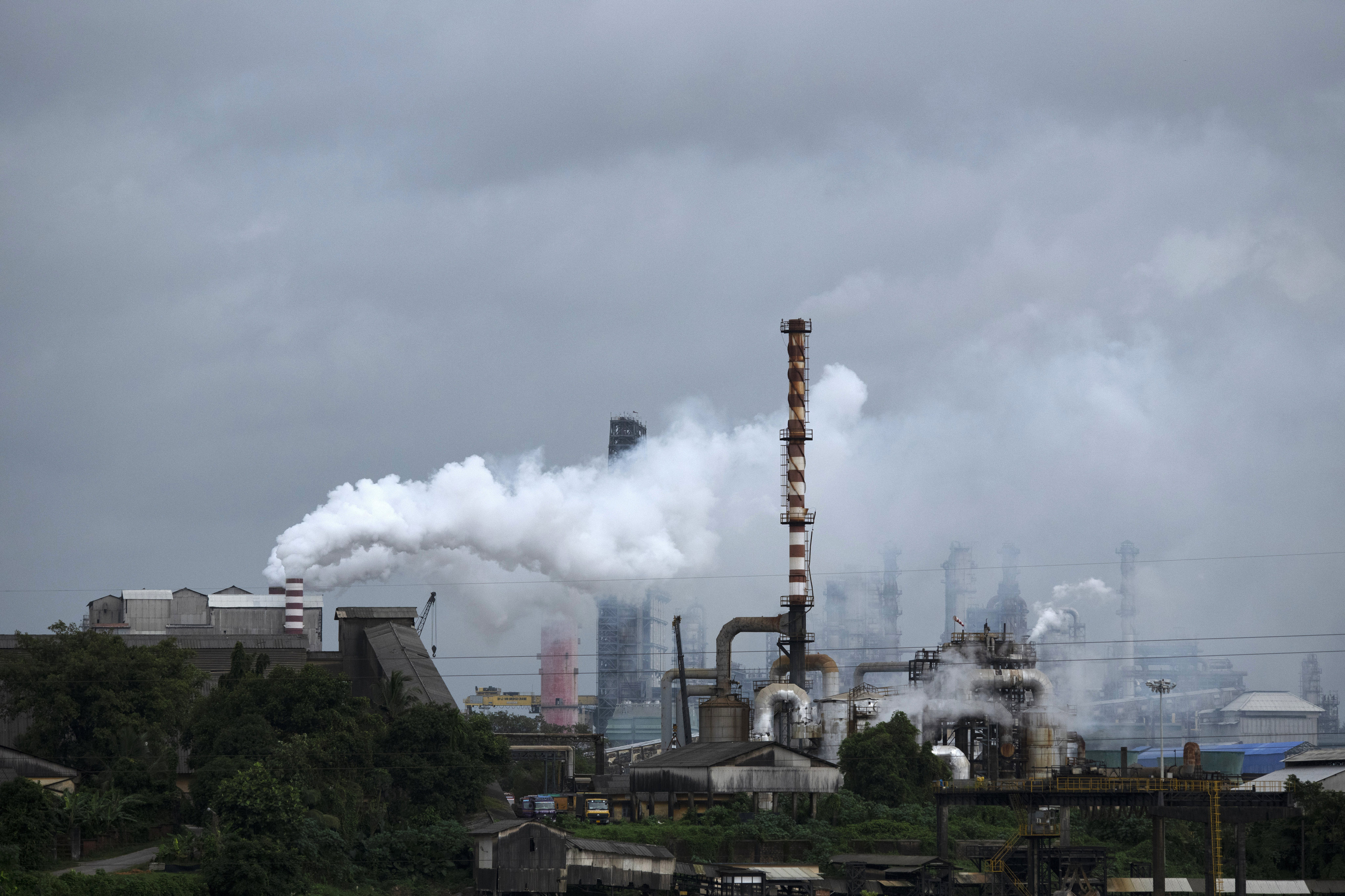 Steam emits from a crude oil refinery in Kerala state, India in August 2022. Photo: AP