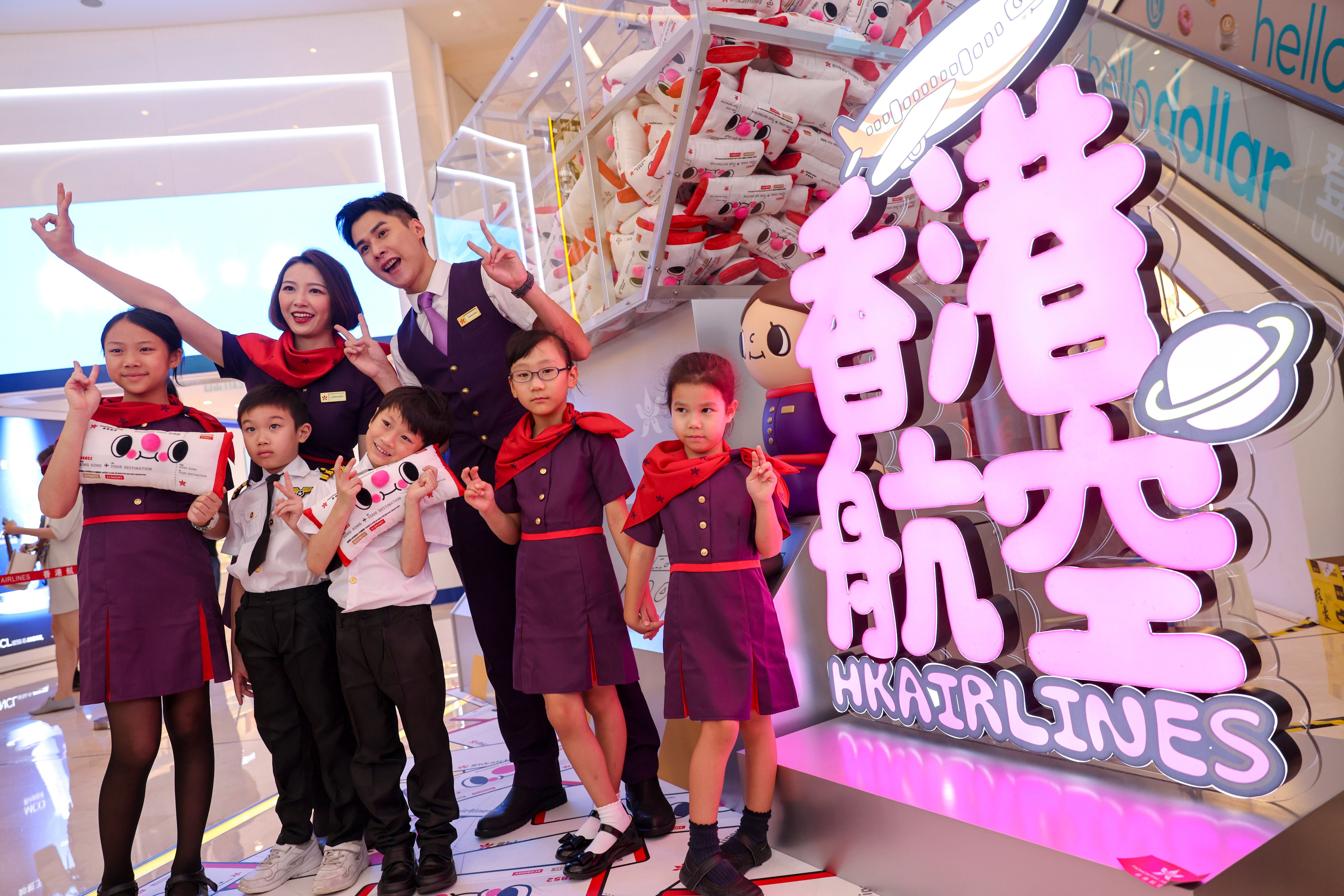 Hong Kong Airlines staff and youngsters on Friday promote the carrier’s ticket giveaway over the weekend. Photo: Yik Yeung-man