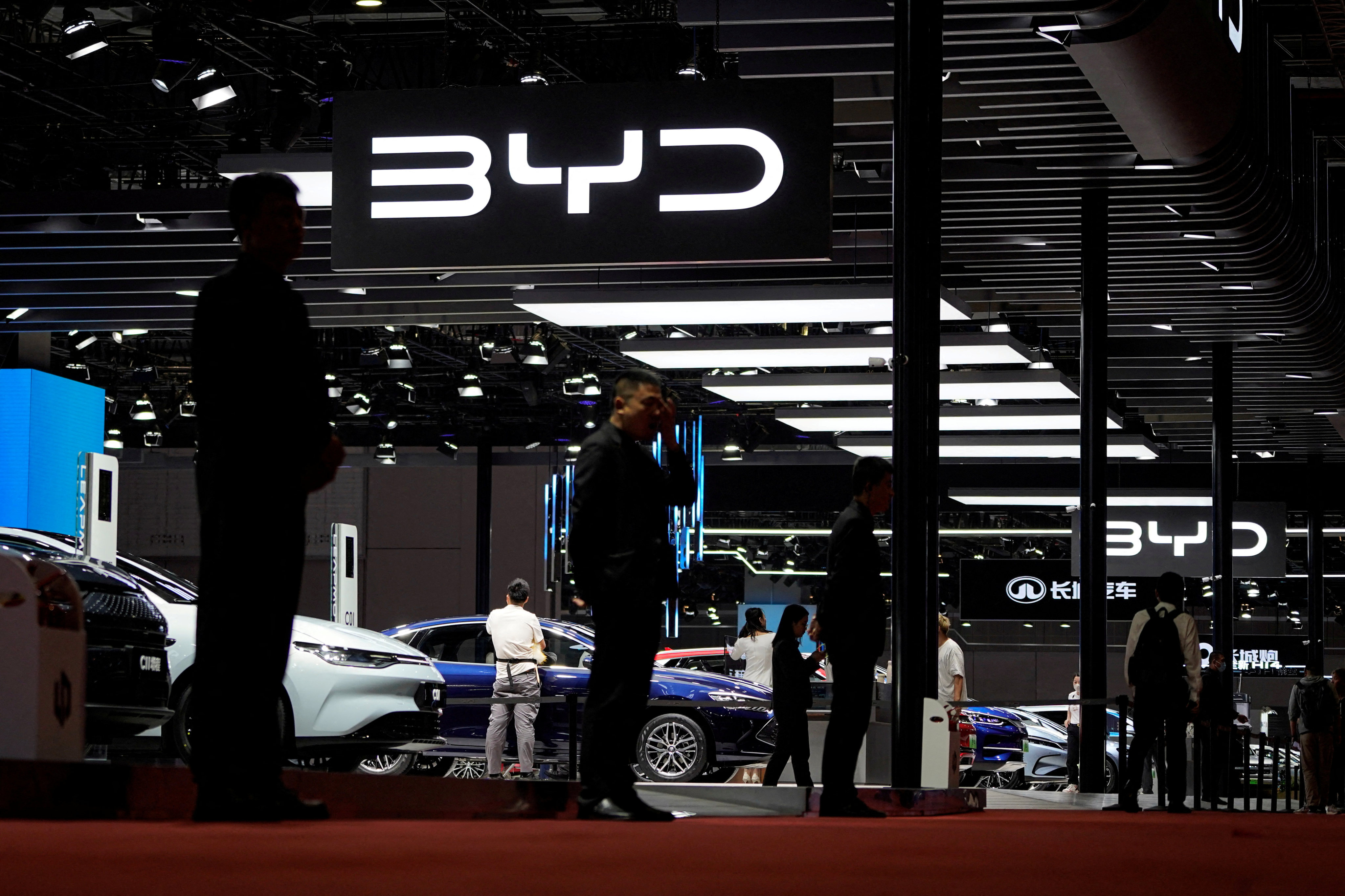 Security guards stand at the BYD booth at the Shanghai auto show, on April 19. In a 2023 ranking of top auto brands, China’s flag-bearer BYD is ranked 12th, the only Chinese carmaker in the top 20. Photo: Reuters