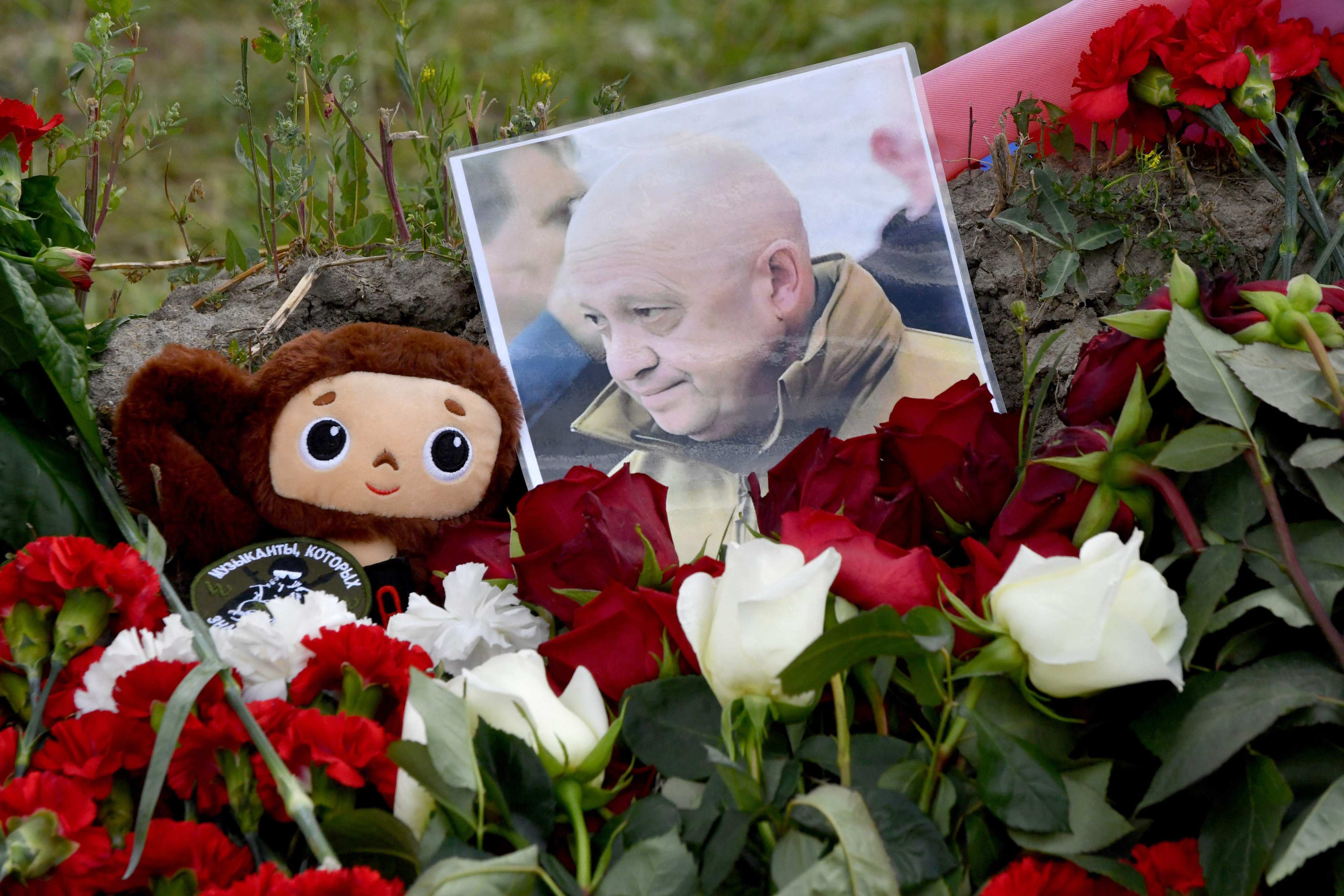 A portrait of Yevgeny Prigozhin amid flowers at a makeshift memorial in front of the Private Military Company Wagner Centre in Saint Petersburg. Photo: AFP