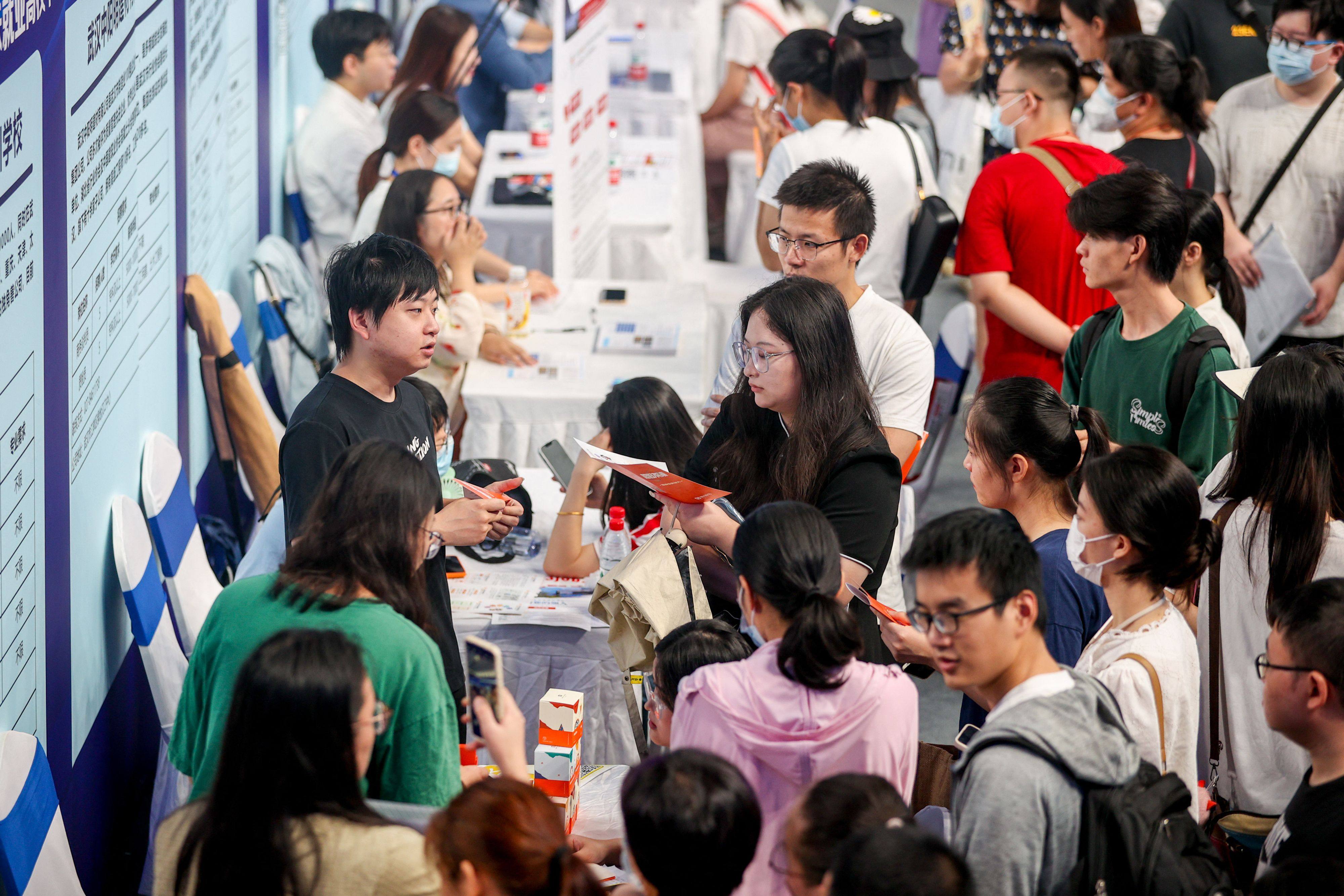 University graduates attend a job fair in Wuhan, in China’s central Hubei province, on August 10. Chinese growth and exports have fallen below expectations and youth unemployment is at a record high. Photo: AFP