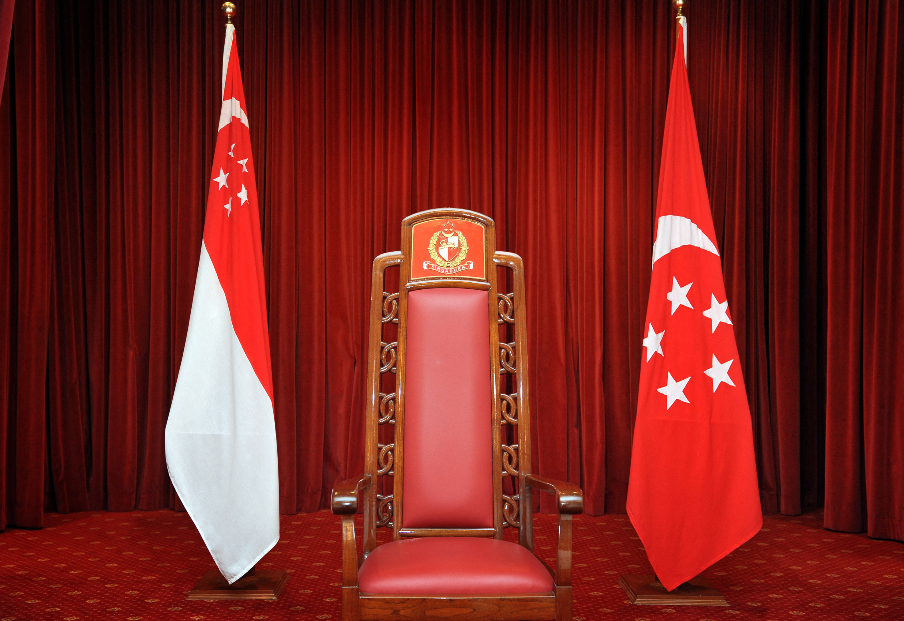 The Presidential chair, flanked by the Singapore flag (left) and the Presidential Standard (right) at the Istana. Photo: SPH Media via AFP