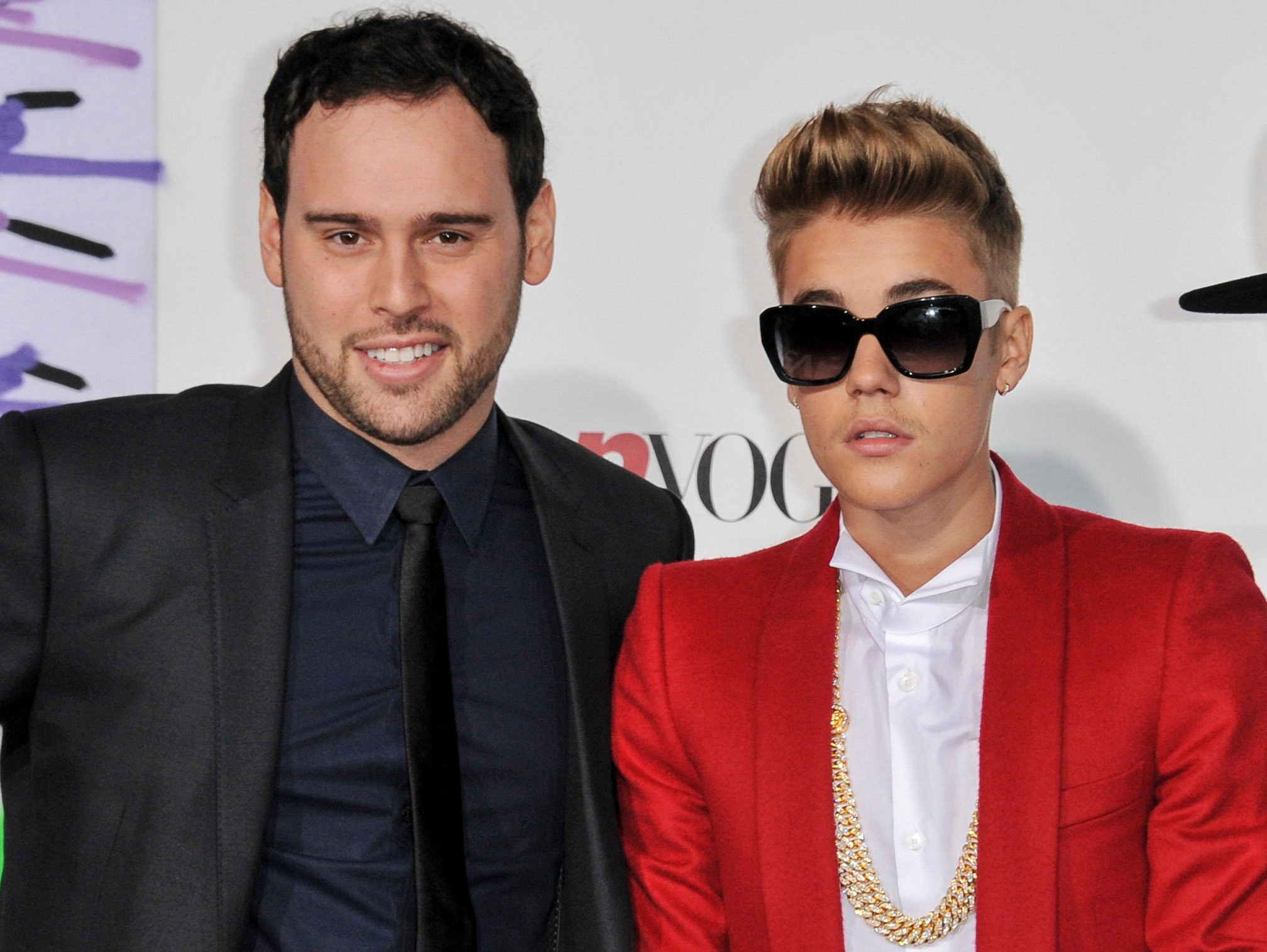 Music executive Scooter Braun, left, appears with Justin Bieber at the World Premiere of Justin Bieber’s Believe in Los Angeles, in December 2013. Photo: Invision/AP