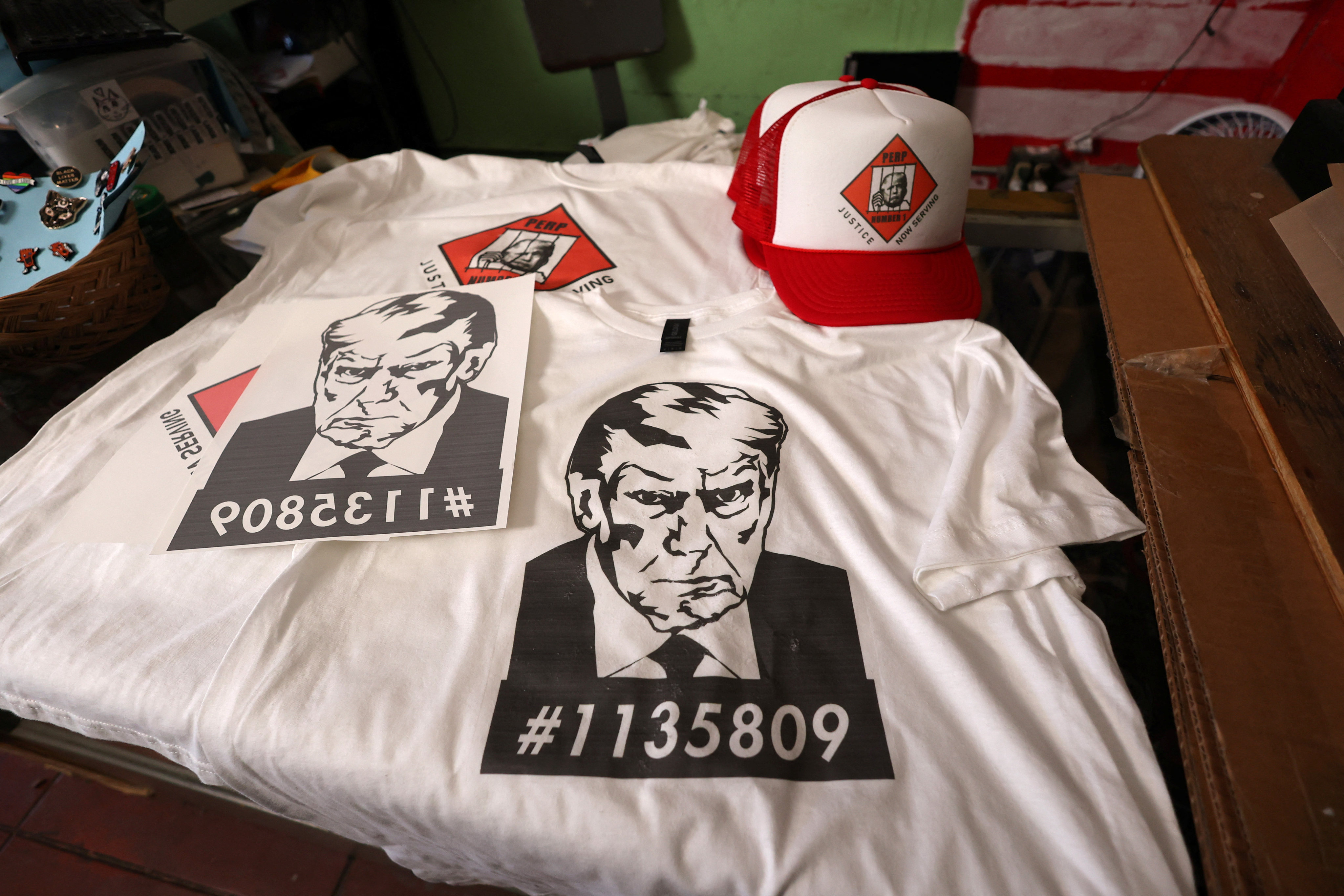 T-shirts and hats with an image depicting the mugshot of former US president Donald Trump at a printing store in Los Angeles, California on Friday. Photo: Reuters