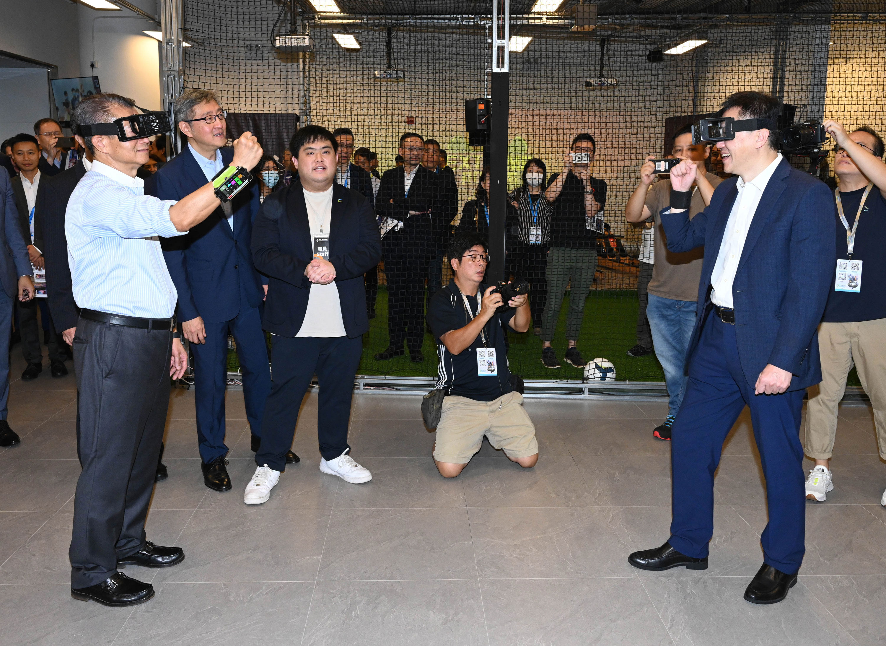 Financial Secretary Paul Chan (left) tried his hand at virtual reality at the Digital Entertainment Leadership Forum over the weekend. Photo: Handout