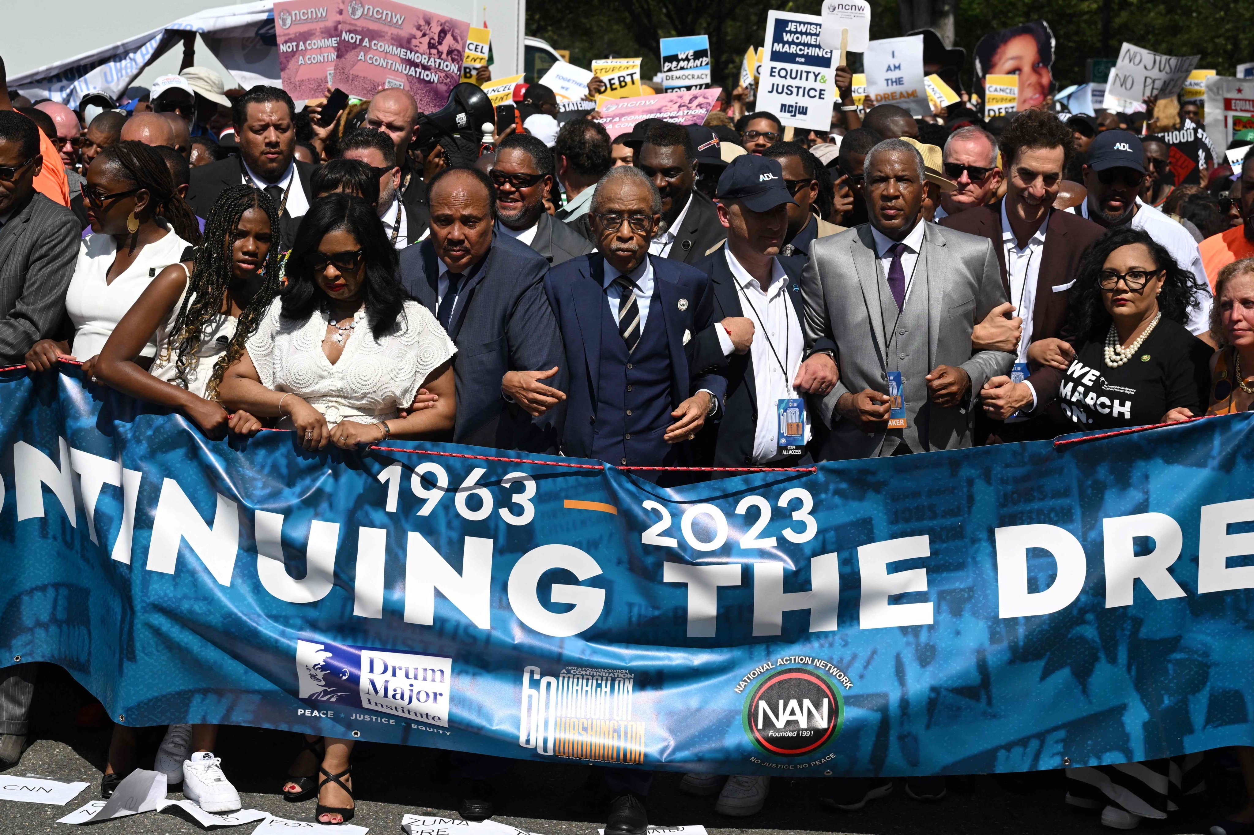 Martin Luther King III, centre left, and the Reverend Al Sharpton, centre right, lead the march on the 60th anniversary of the civil rights March on Washington, in Washington on Saturday. Photo: AFP