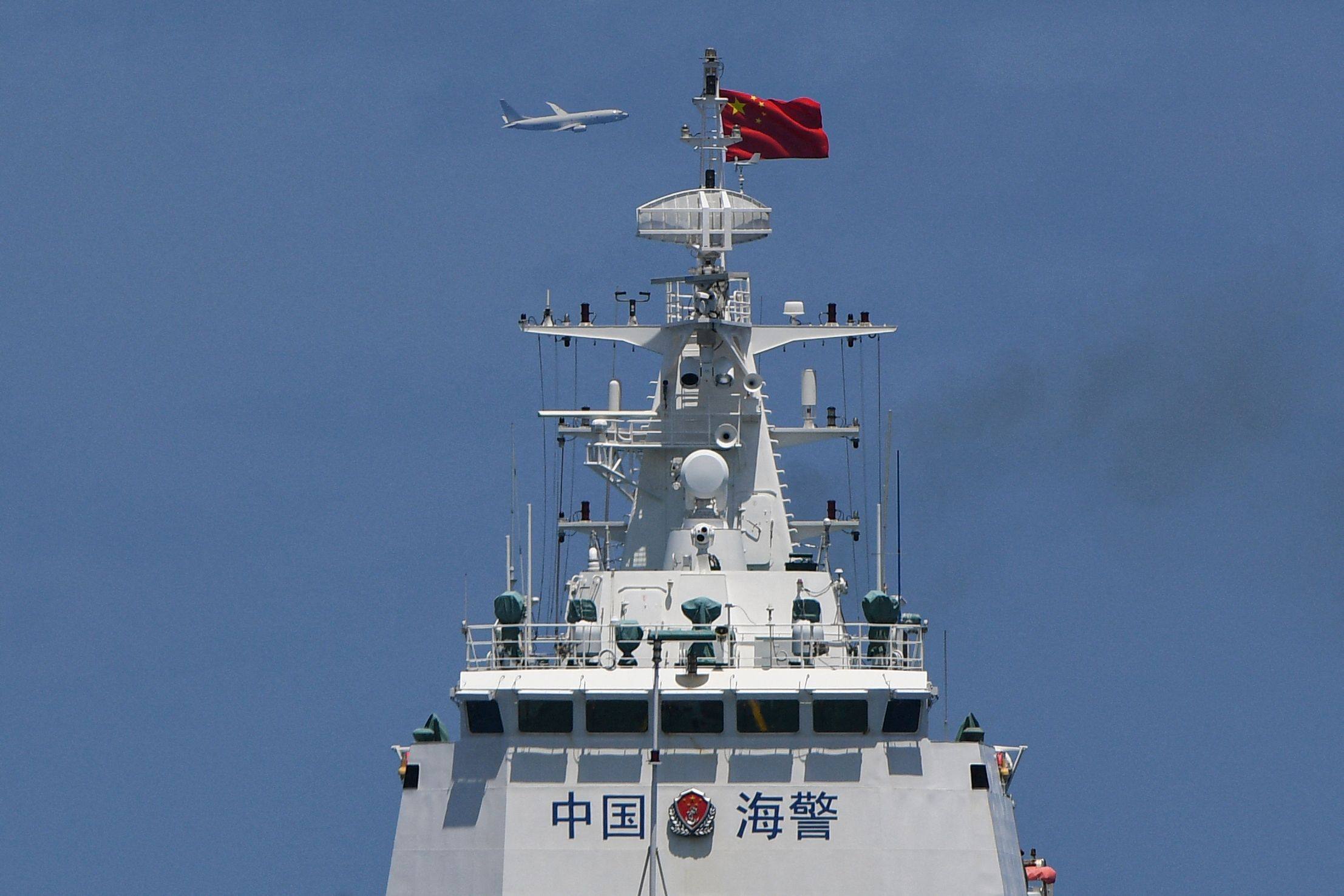 A P-8 Poseidon patrol and reconnaissance aircraft of the US Navy circles around a Chinese coastguard ship in the South China Sea earlier this month. Photo: AFP