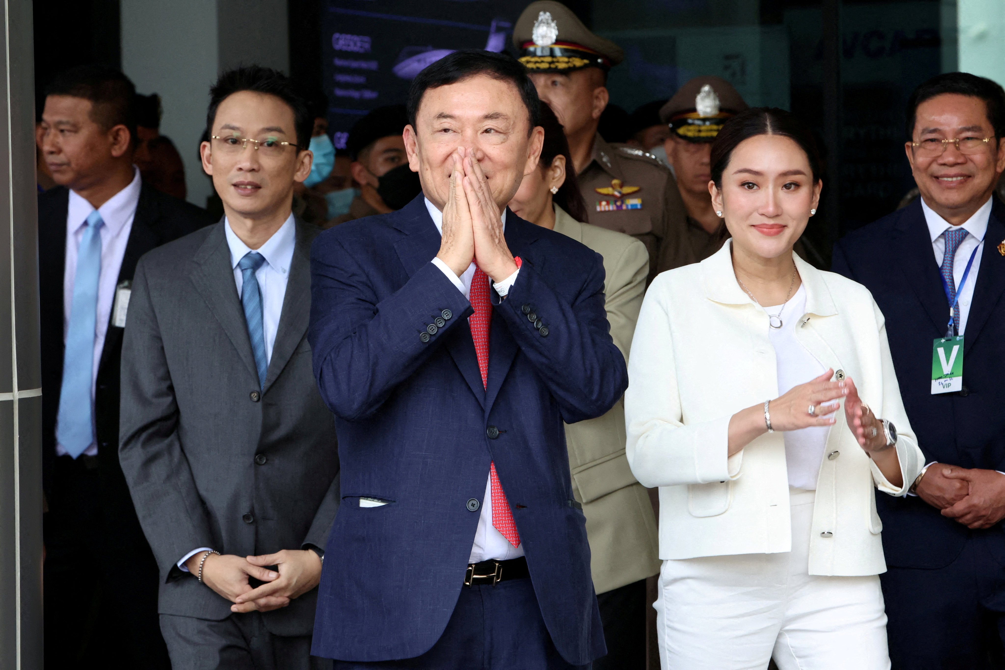 Former Thai Prime Minister Thaksin Shinawatra beside his daughter Paetongtarn Shinawatra at Don Mueang airport in Bangkok on August 22. Photo: Reuters