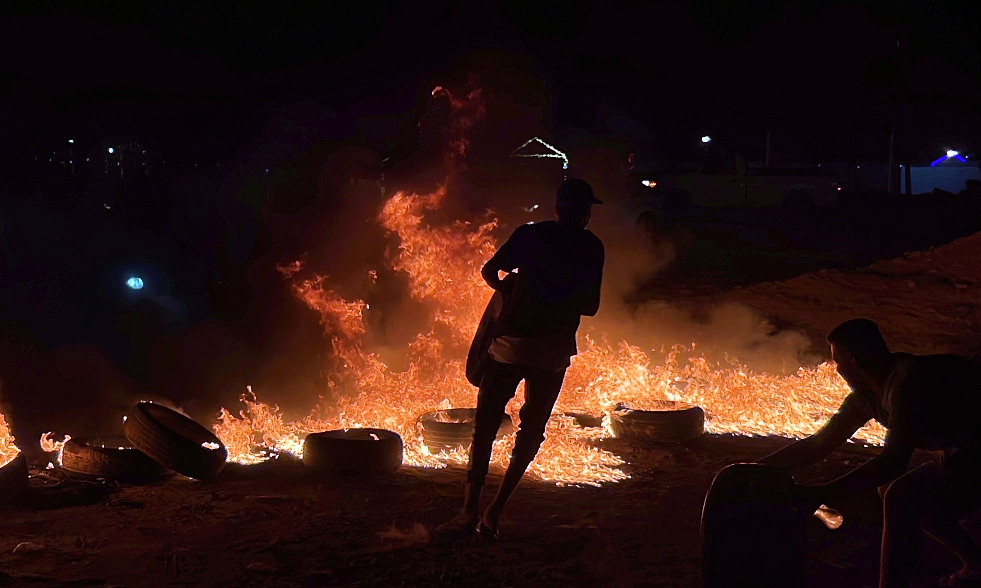 Libyans in Tripoli on Sunday burn tyres in protest against foreign minister Najla al-Mangoush’s meeting with her Israeli counterpart in Italy. Photo: EPA-EFE