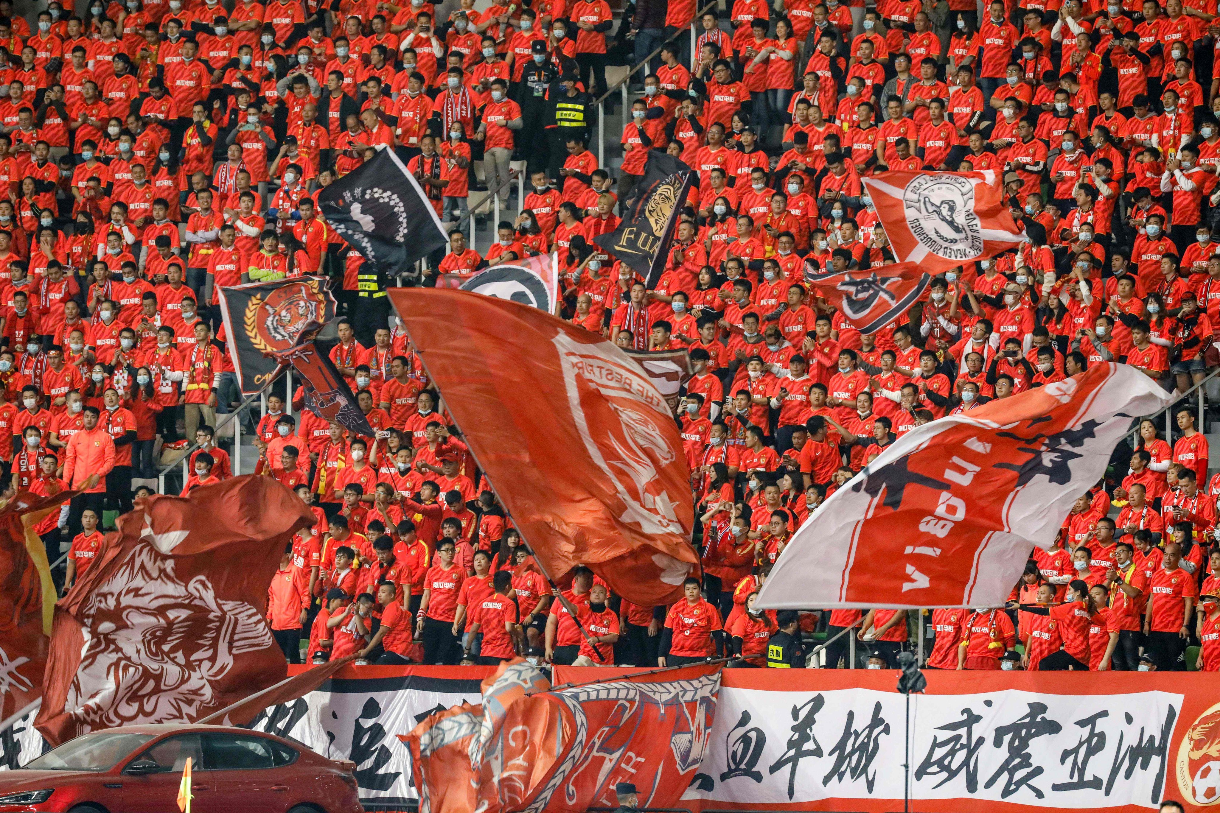 Fans of Guangzhou Evergrande watch 2020’s Chinese Super League final against Jiangsu Suning, before both clubs were beset by financial problems. Photo: AFP