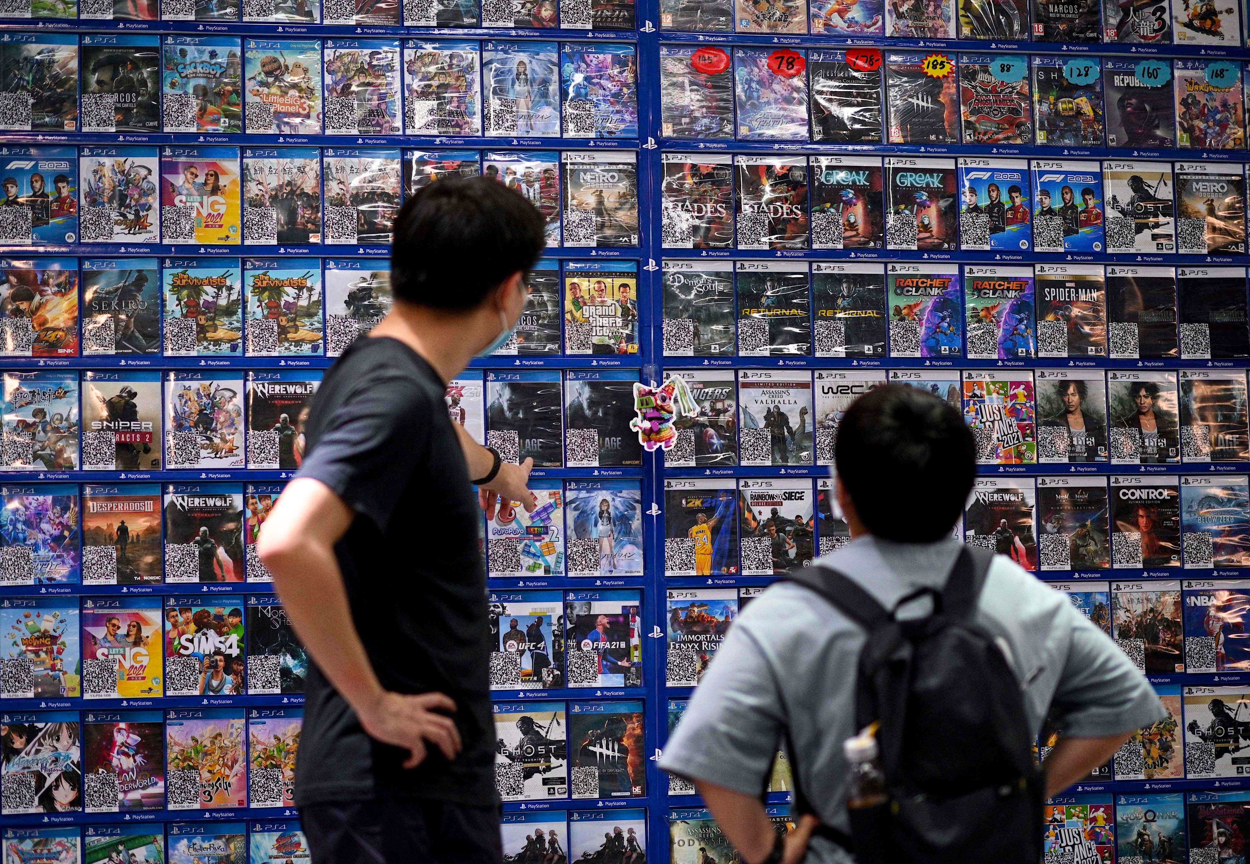 People look at console games at a store in Beijing on August 31, 2021. Photo: AFP