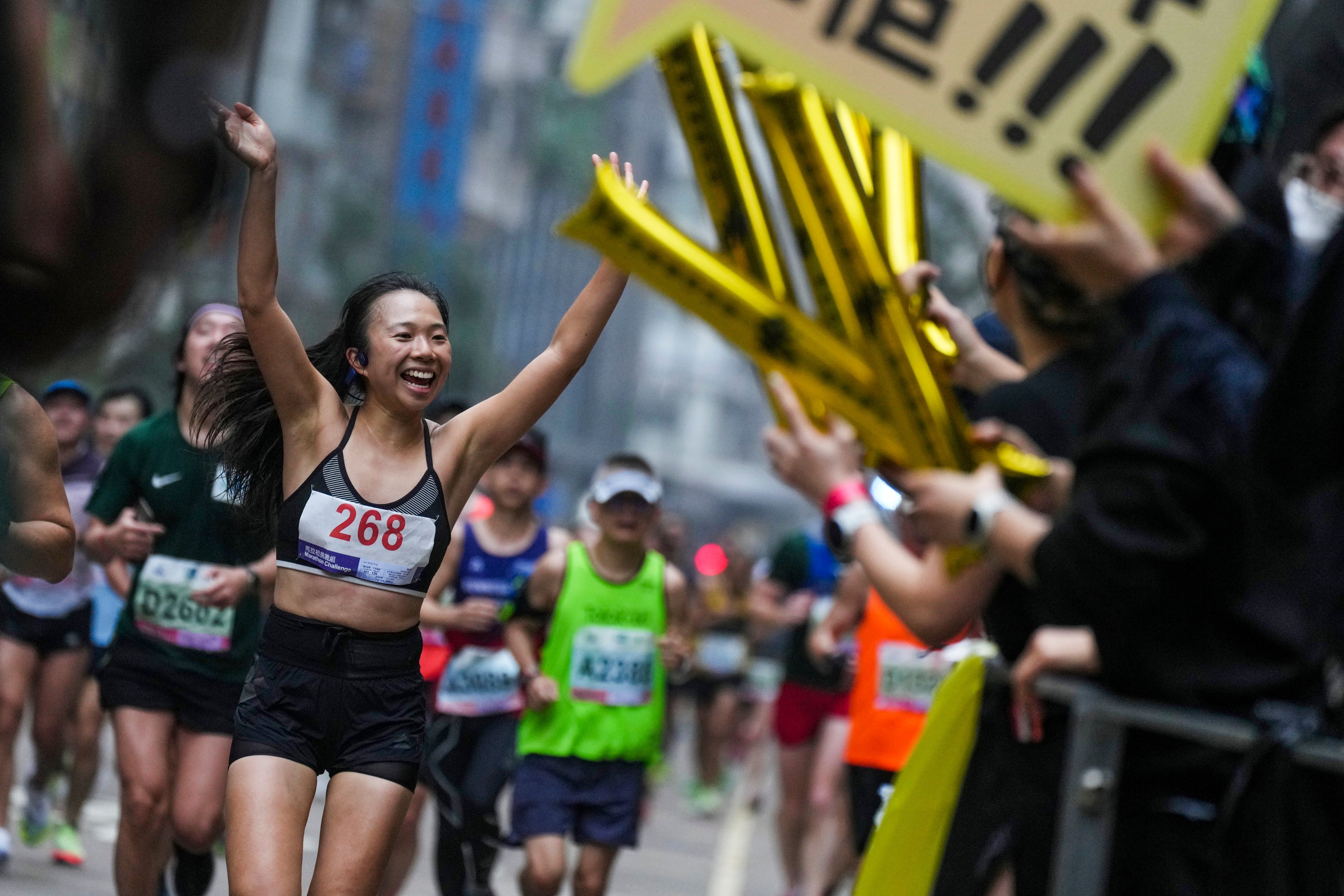 Runners move along Lockhart road in Wan Chai during the 2023 Hong Kong Marathon. Photo: Elson Li