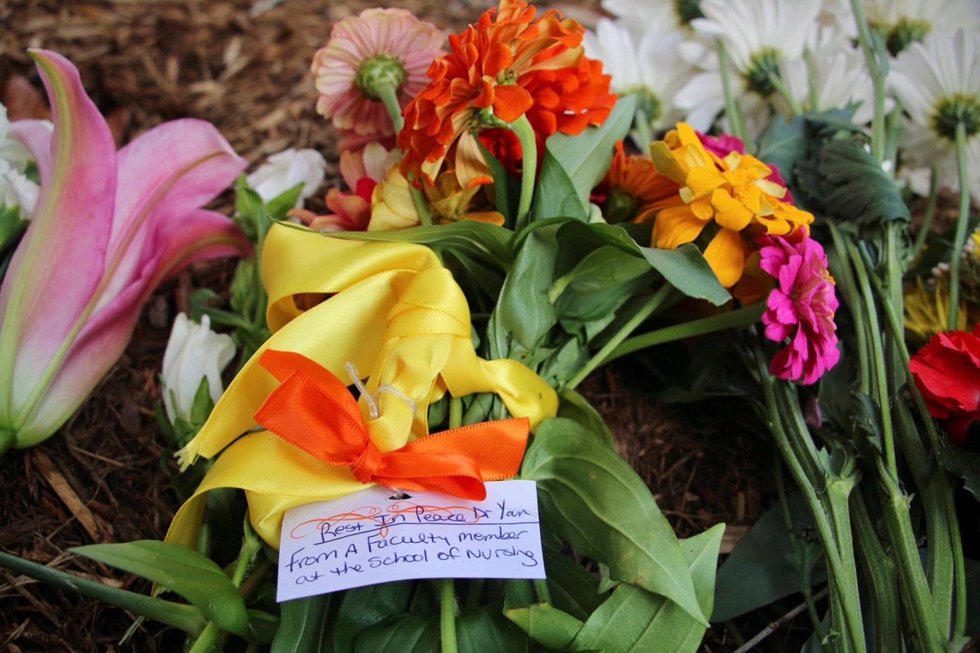 Flowers are seen piled up in front of Caudill Labs in Chapel Hill, North Carolina, where the fatal shooting took place on Monday. Photo: AP