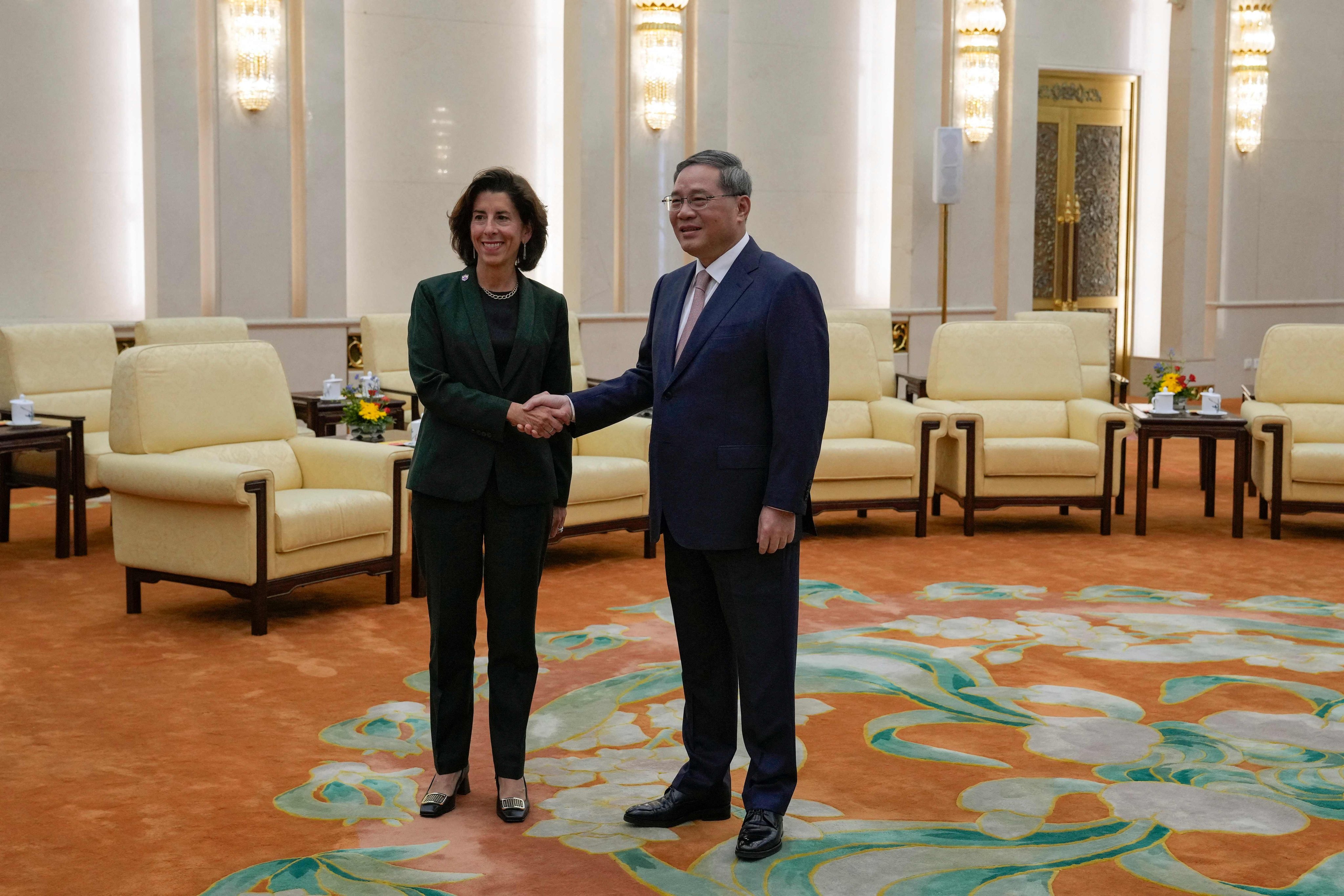 China’s Premier Li Qiang with US Commerce Secretary Gina Raimondo. Photo: AFP