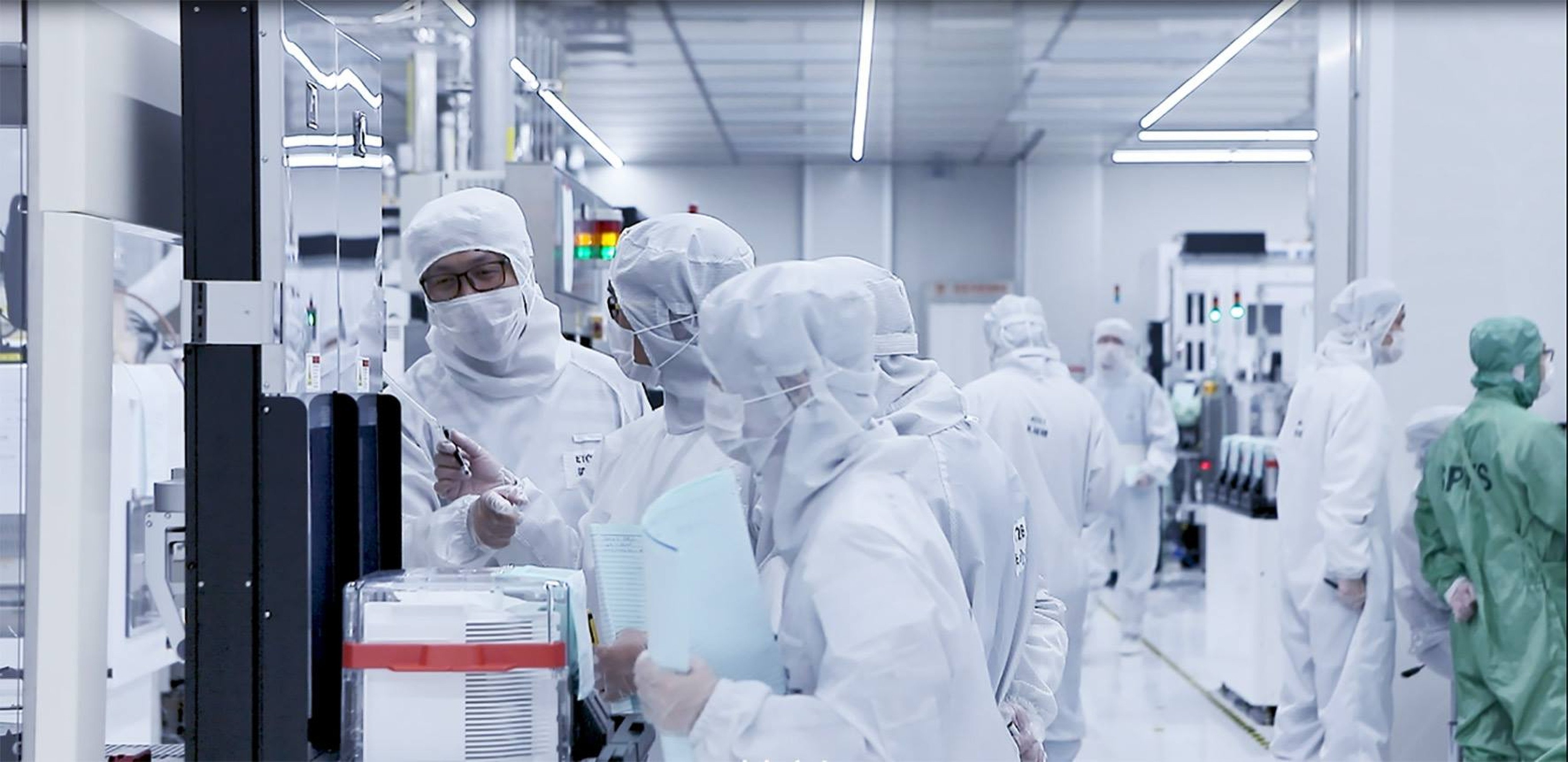 Workers are seen inside a cleanroom at chip maker Ningbo Semiconductor International Corp in eastern Zhejiang province. Photo: Handout
