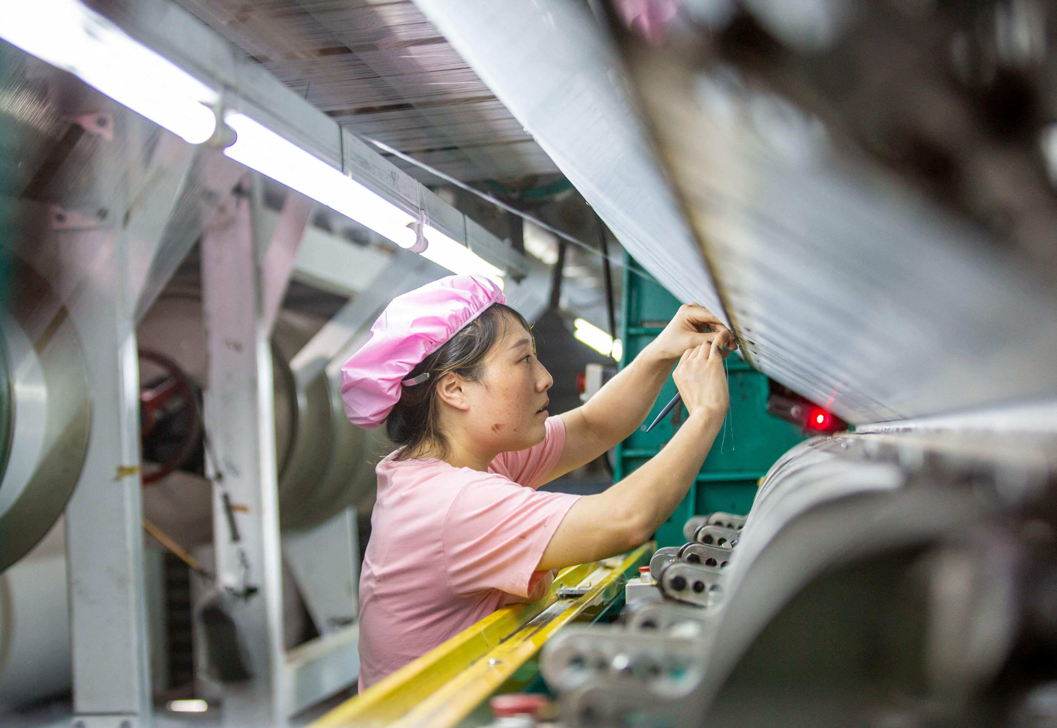 China’s official manufacturing purchasing managers’ index (PMI) rose to 49.7 in August from 49.3 in July. Photo: AFP