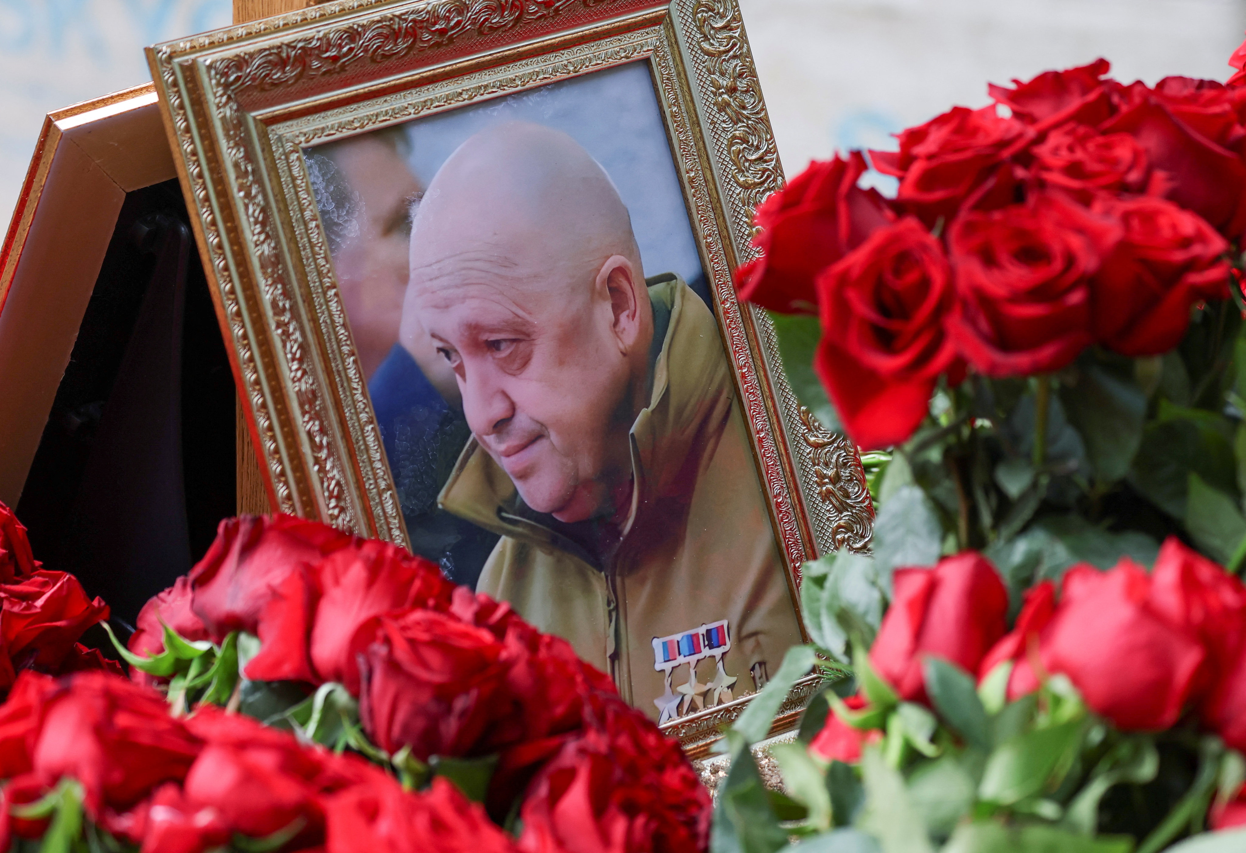 A framed photo of Russian mercenary chief Yevgeny Prigozhin is seen on his grave at the Porokhovskoye cemetery in St Petersburg, Russia on Wednesday. Photo: Reuters