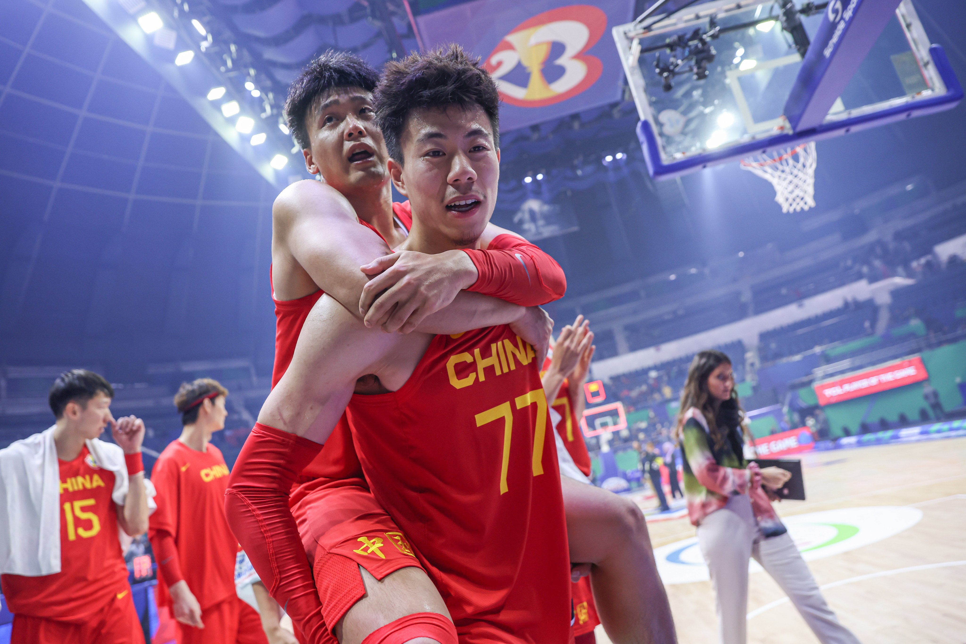Zhang Zhenlin of China carries his teammate Zhao Rui after the 17-32 win against Angola at the 2023 FIBA World Cup in Manila. Photo: Xinhua