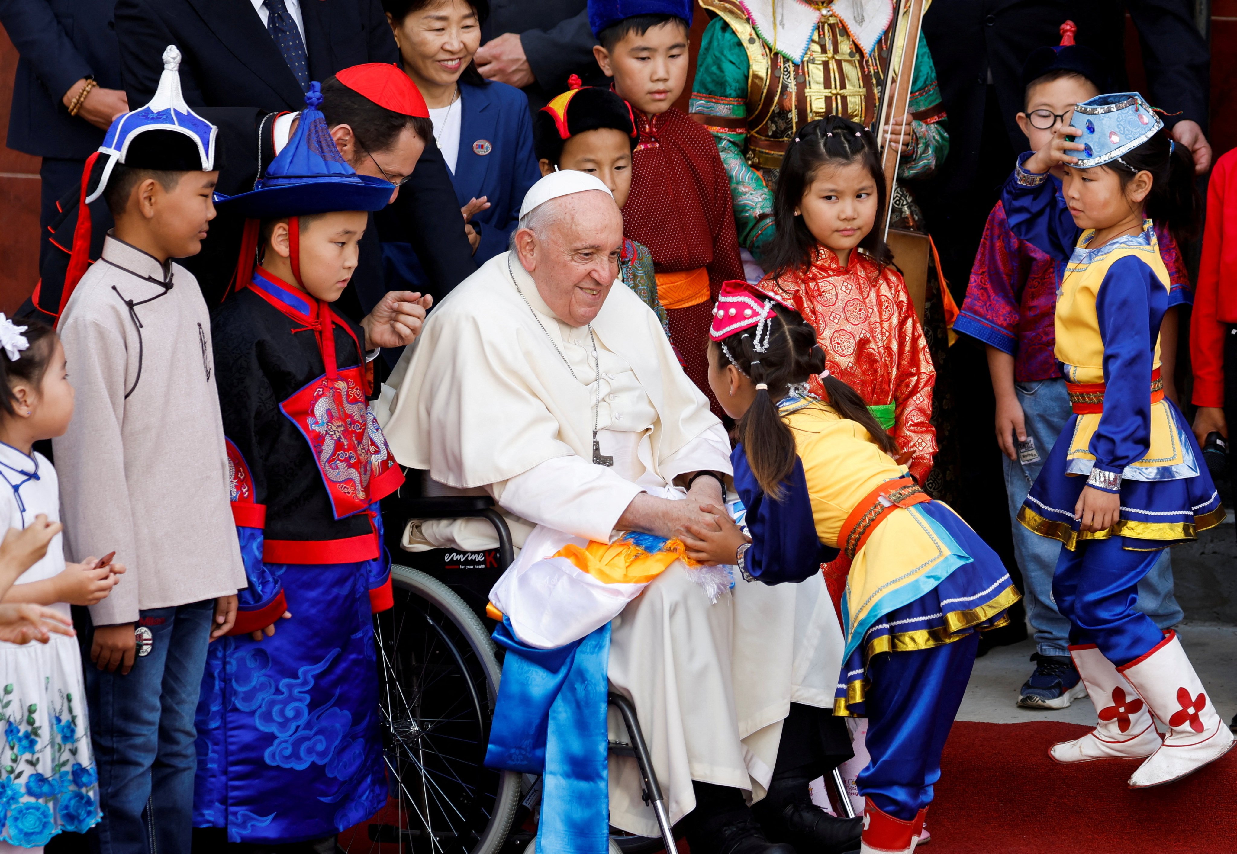 Pope Francis greets a child during a welcoming ceremony in Ulaanbaatar, Mongolia. Photo: Reuters