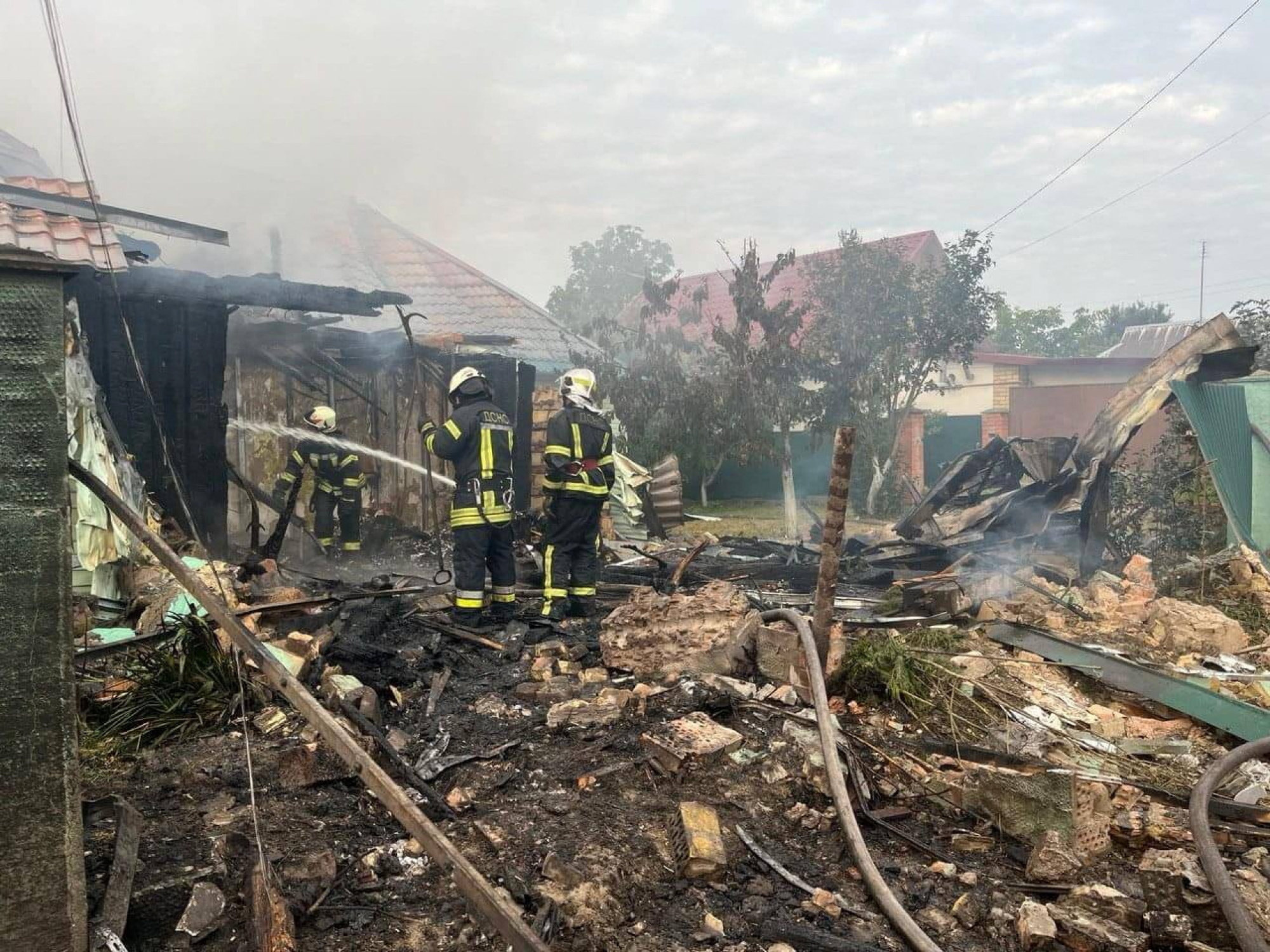 Rescuers work at a site of buildings damaged in the night by Russian drone and missiles strike. Photo: Reuters