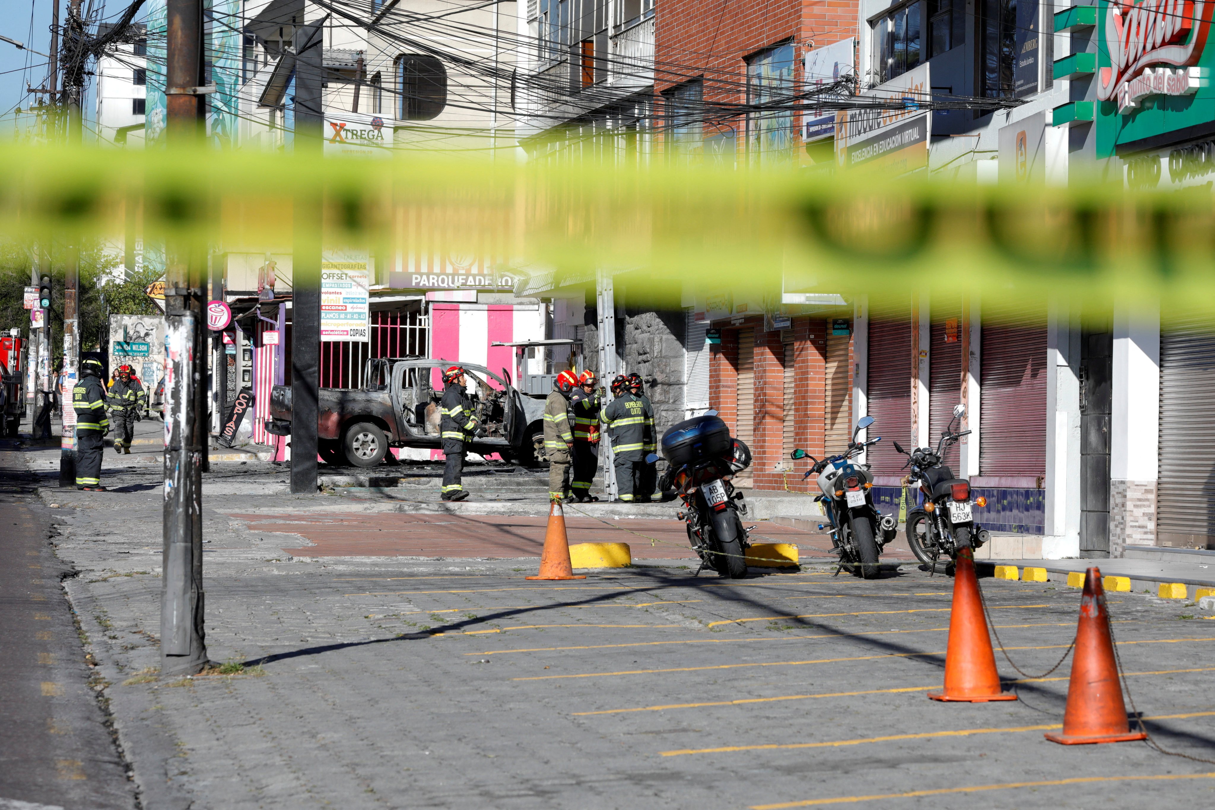 Firefighters at the scene of a car explosion in Quito, Ecuador. Photo: Reuters