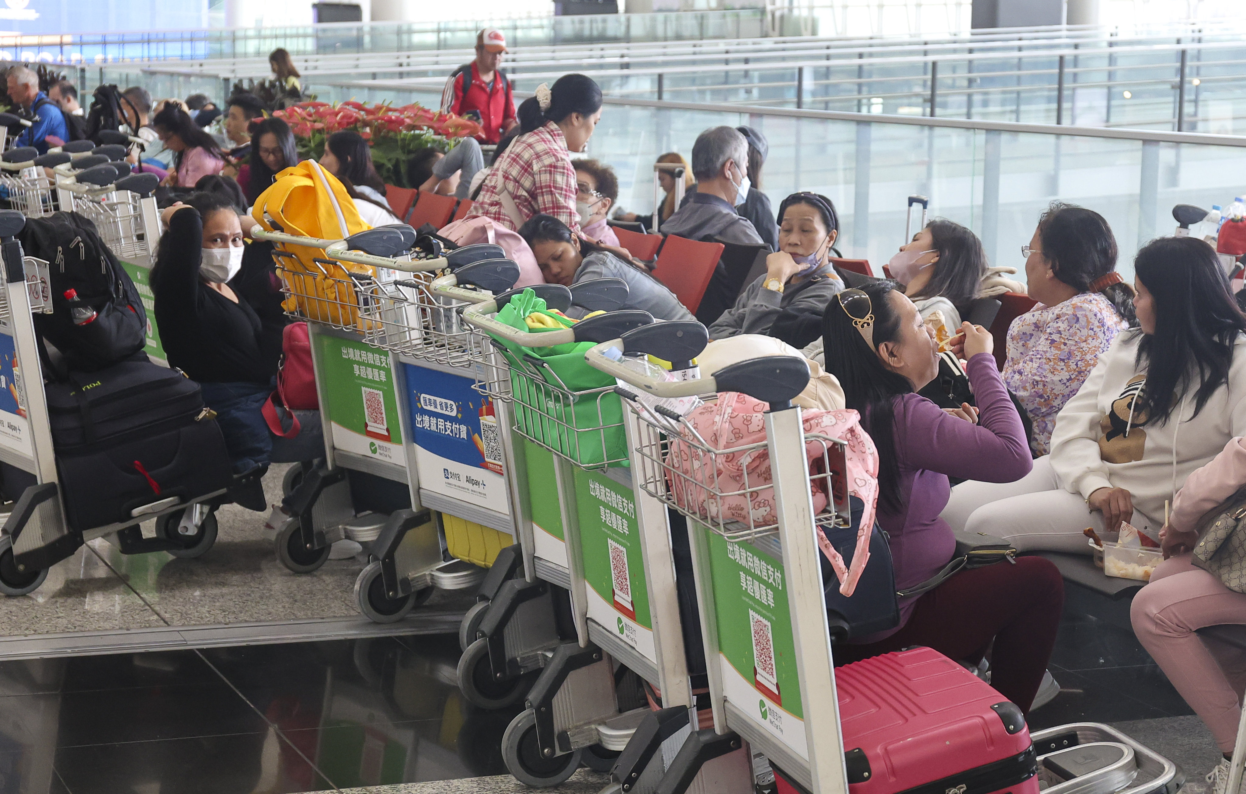 Stranded passengers at Hong Kong’s airport since Friday wait for flights to resume. Photo: Edmond So