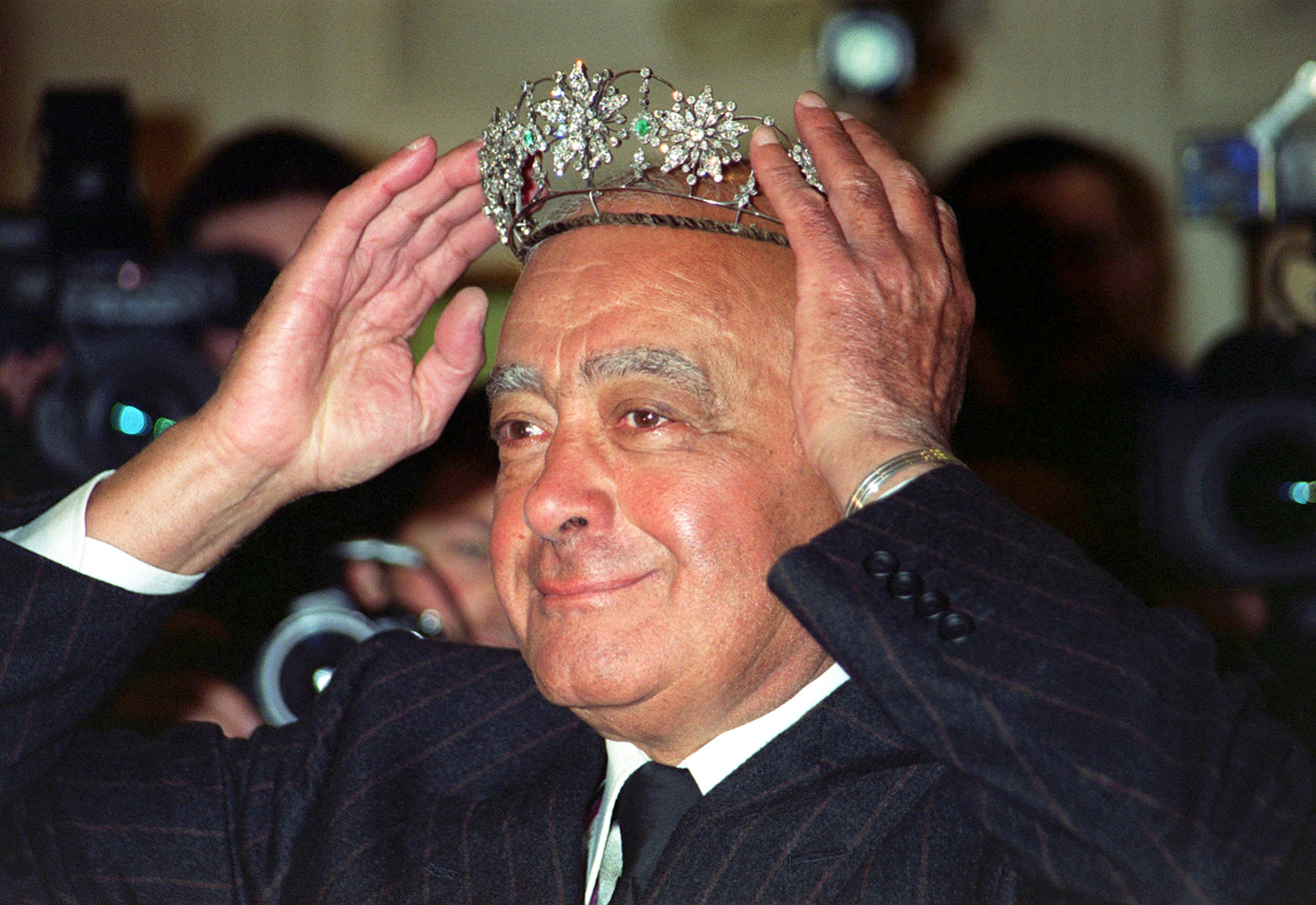 Mohamed Al Fayed donning a Victorian emerald and diamond tiara in Harrods, the iconic British department store he once owned. Photo: dpa