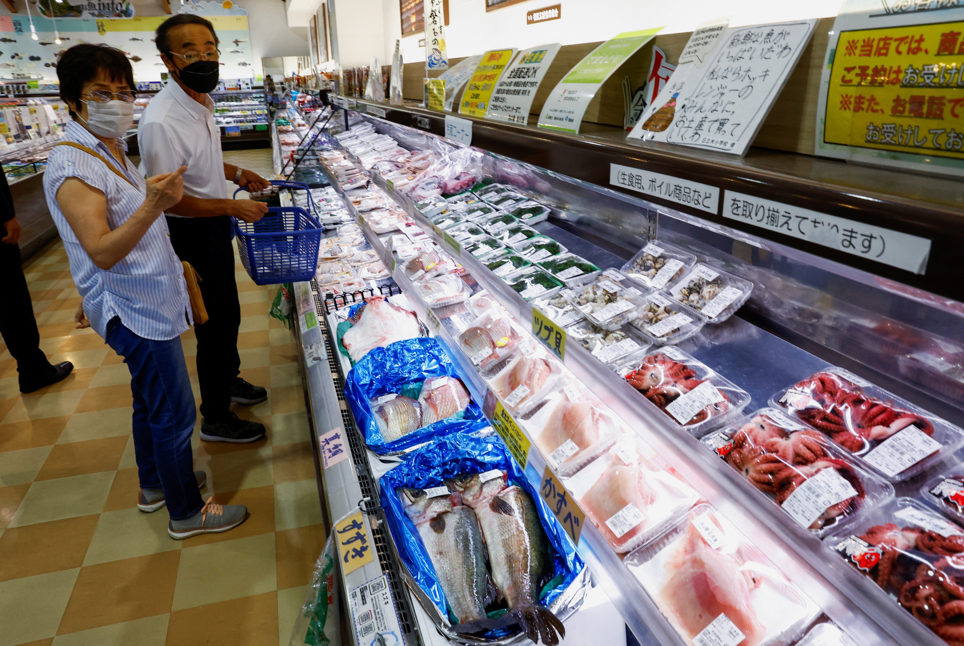 Shoppers browse locally caught seafood in Soma, Fukushima prefecture, Japan, on Thursday. There have been protests over Japan’s decision to release waste water from the Fukushima nuclear plant into the Pacific Ocean despite tests and testimony suggesting it is no more radioactive than many naturally occurring substances. Photo: Reuters