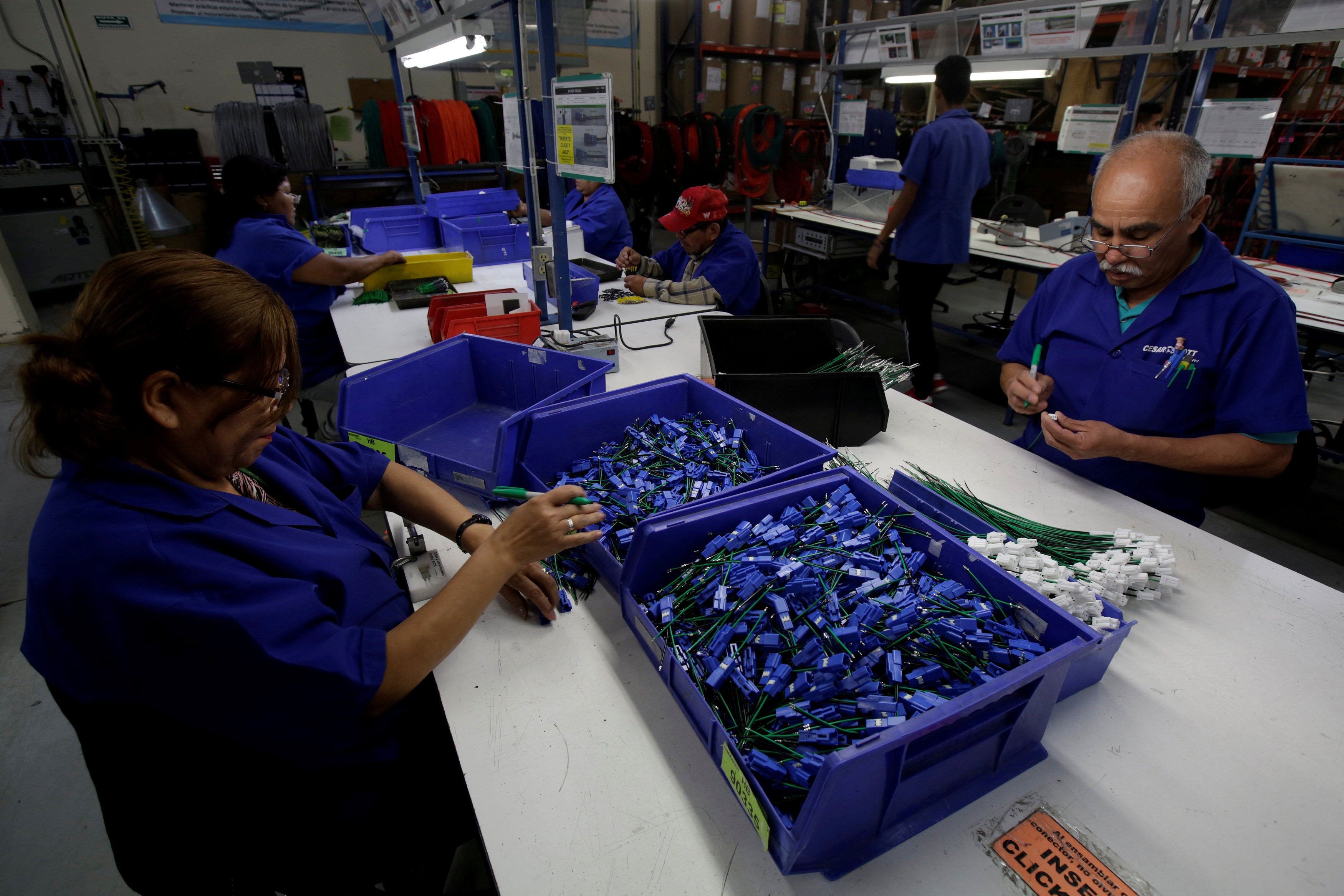 Employees work at a wire harness and cable assembly manufacturing company that exports to the US, in Ciudad Juarez, Mexico. In the near term, Mexico can expect sectors where there is already a substantial footprint – such as computer assembly and motor vehicle parts – to bolster that presence. Photo: Reuters