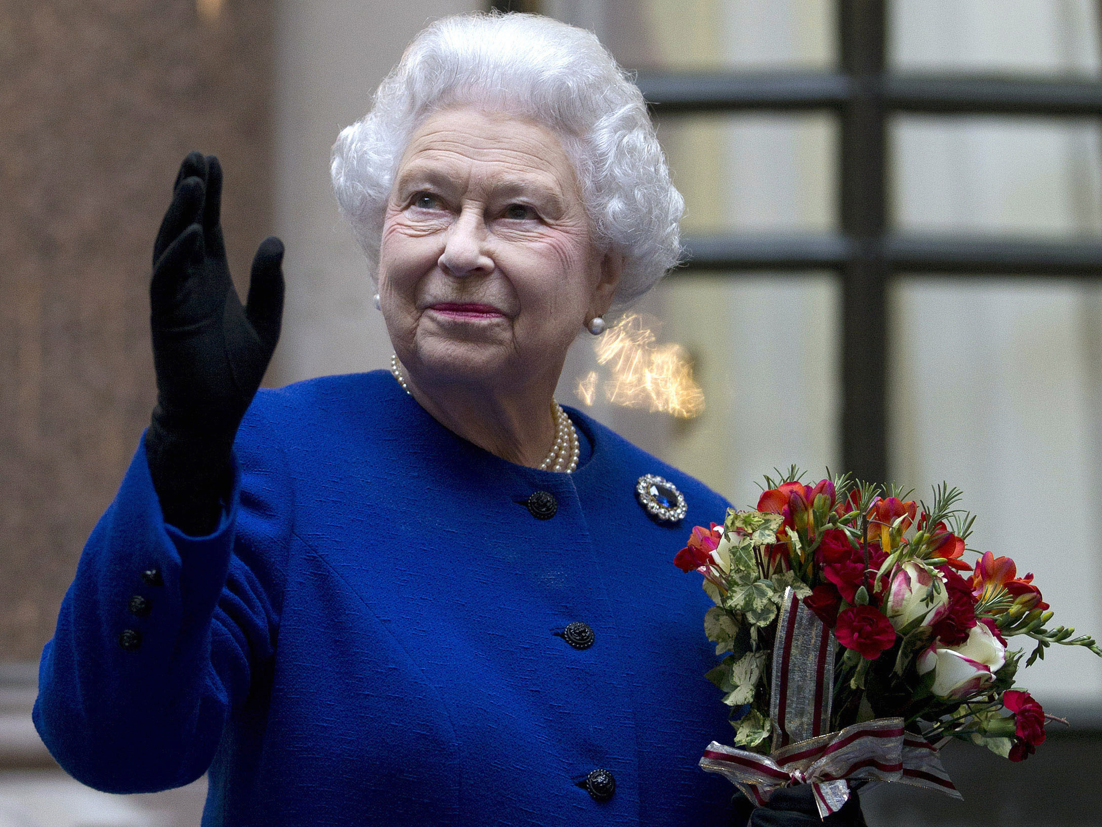 Britain’s Queen Elizabeth waves to members of staff of The Foreign and Commonwealth Office as she ends an official visit as part of her Jubilee celebrations in London in December 2012. Photo: AP